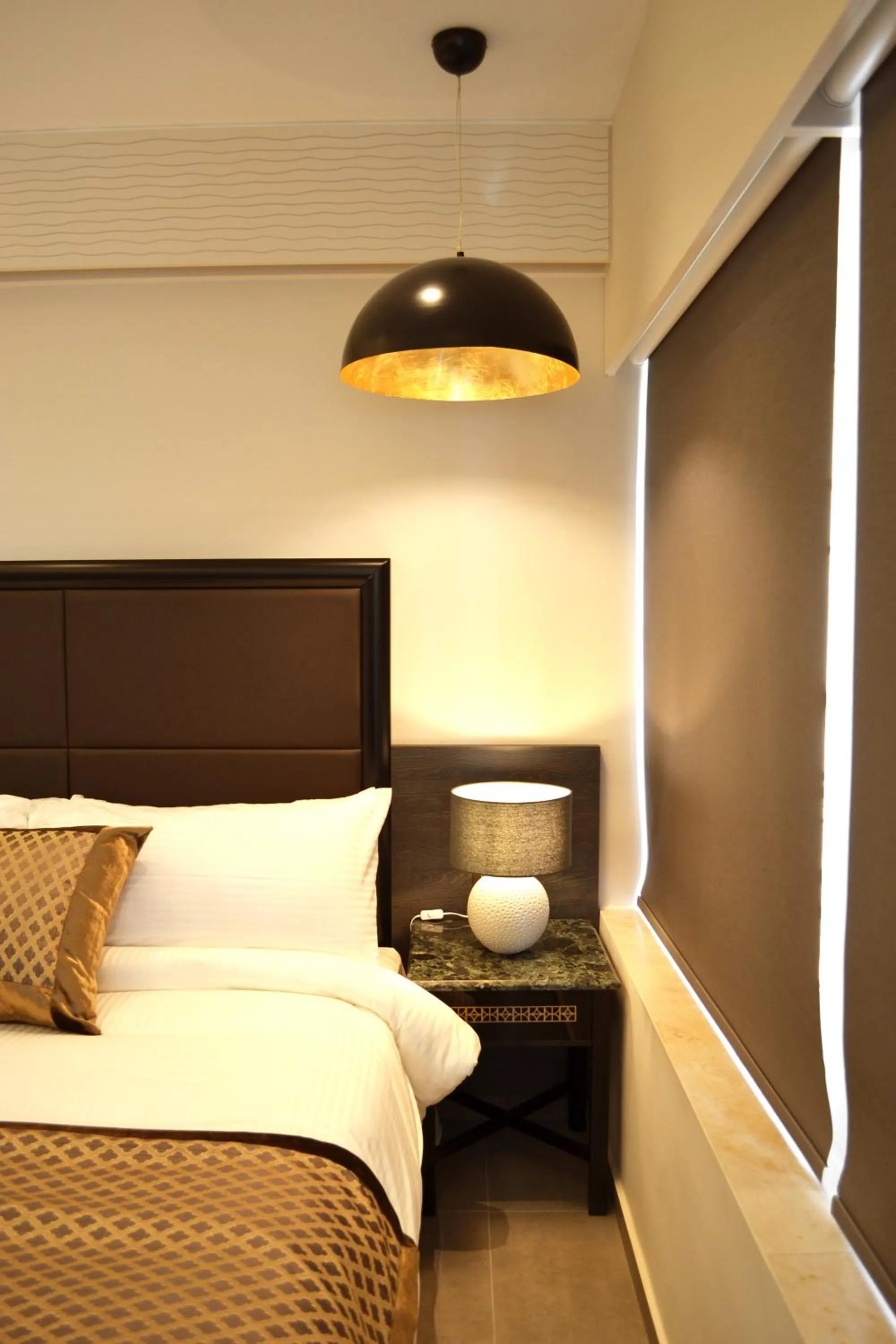 Bed in Ambassador, a Boutique Hotel