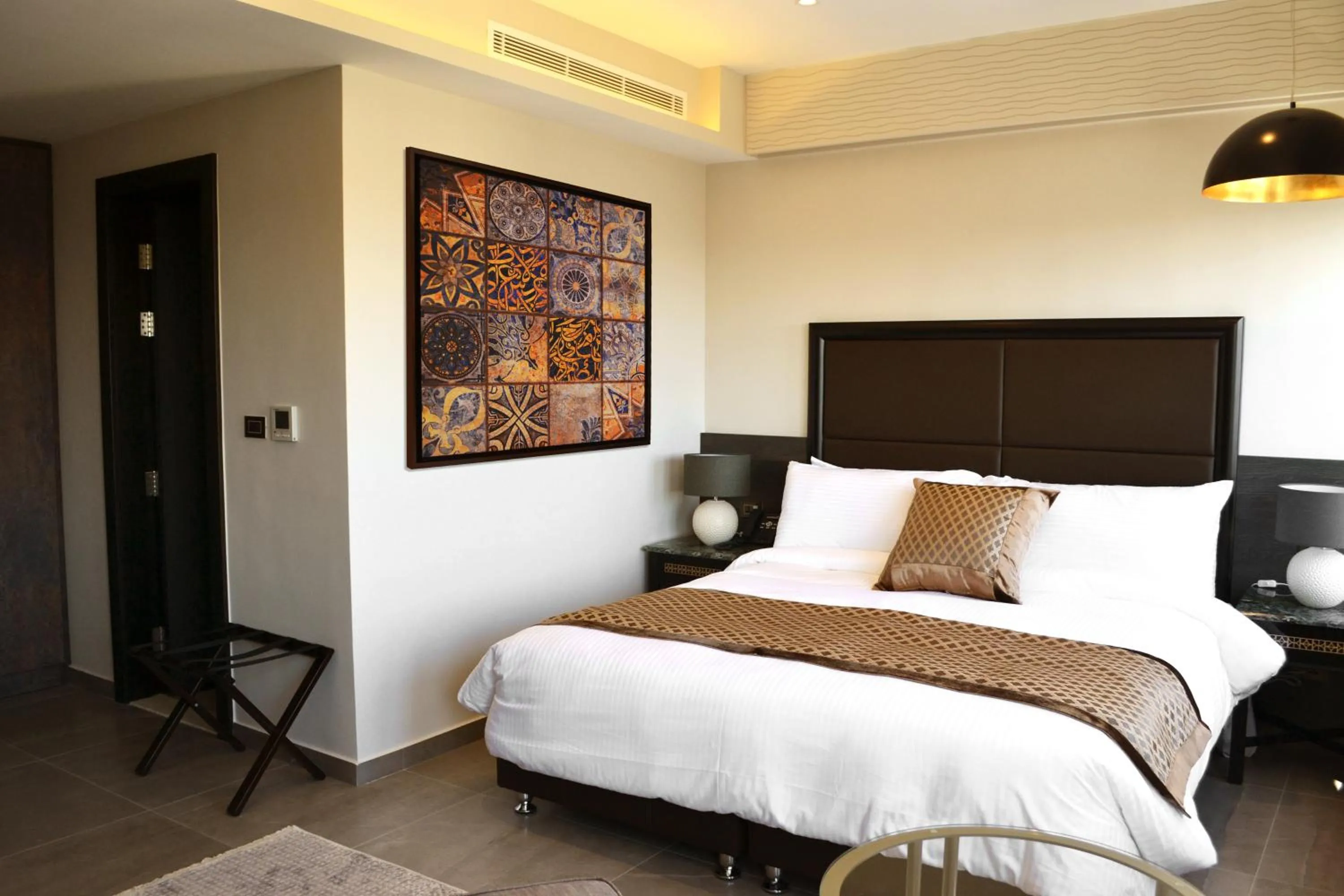 Bed in Ambassador, a Boutique Hotel