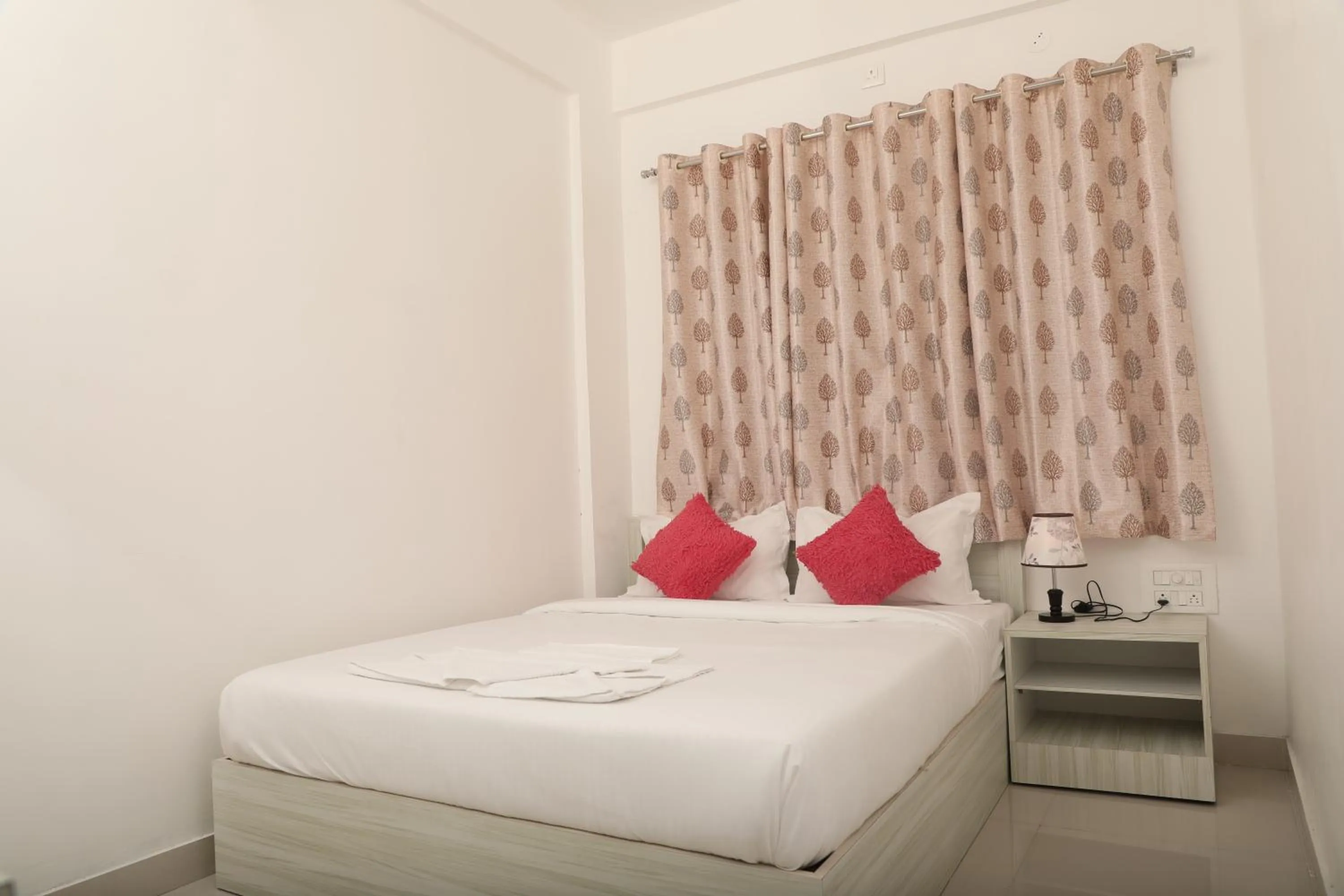 Bed in Sai Inn Mysore