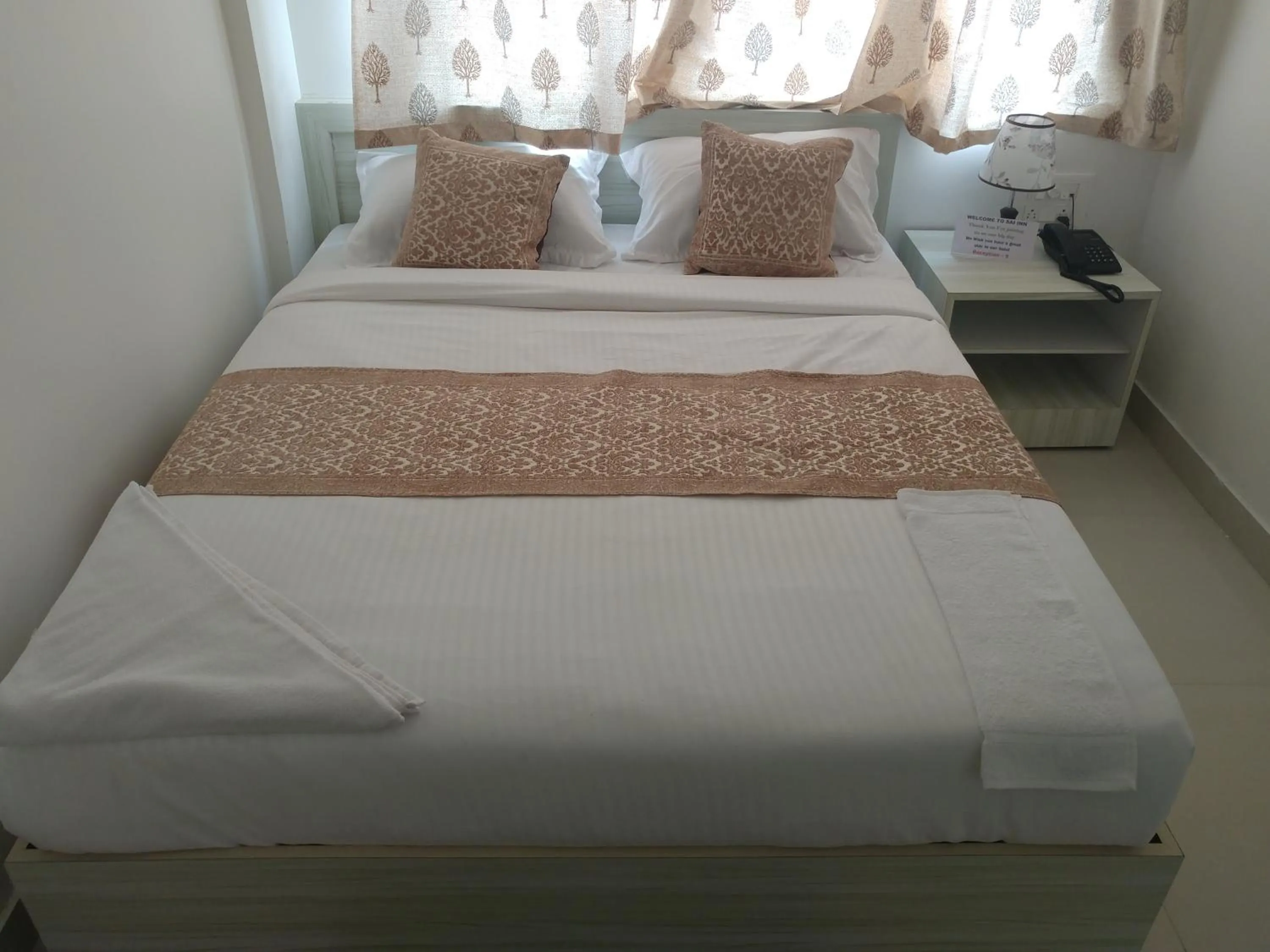 Bed in Sai Inn Mysore