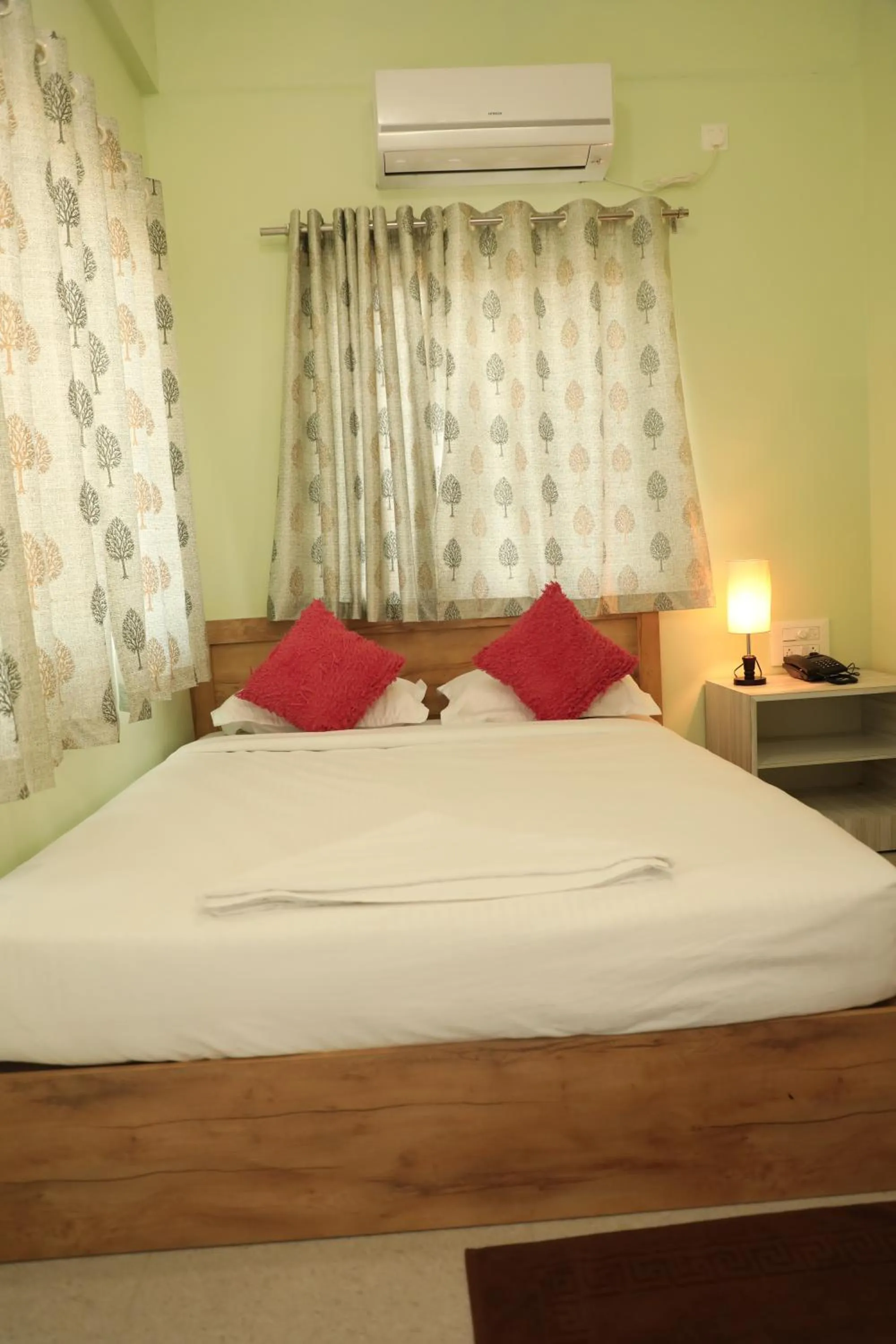 Bed in Sai Inn Mysore