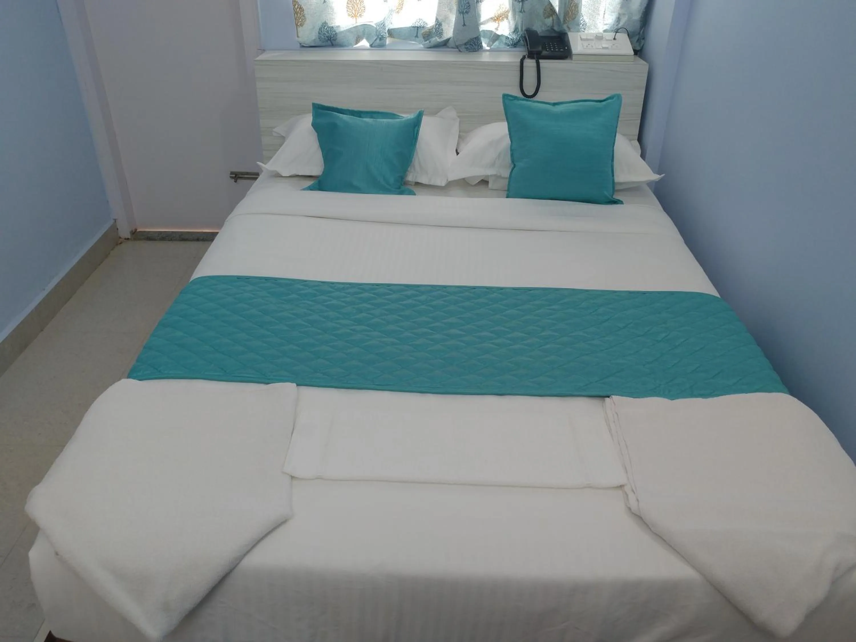 Bedroom, Bed in Sai Inn Mysore