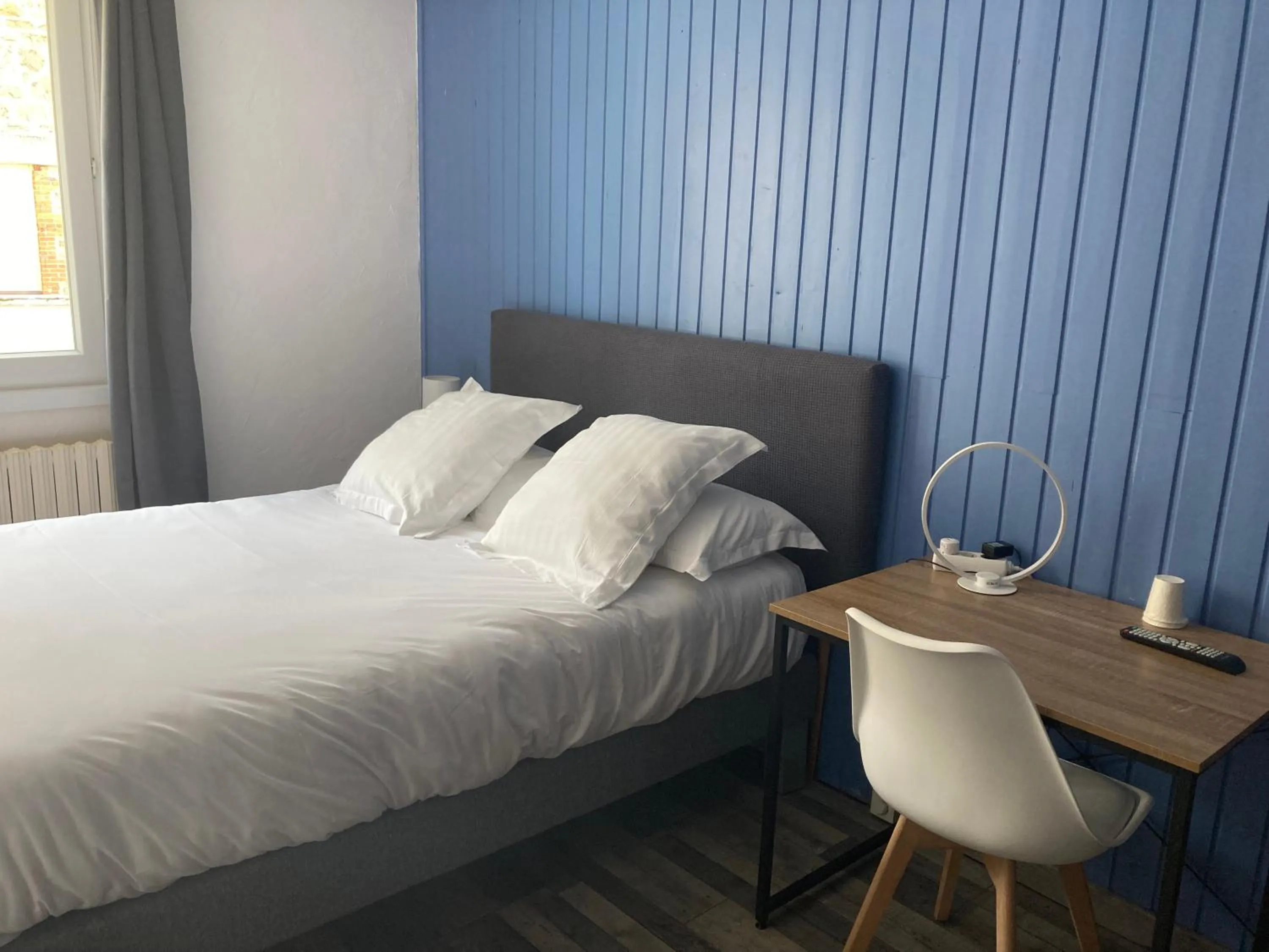 Bedroom in Logis Hôtel Restaurant Le 1050