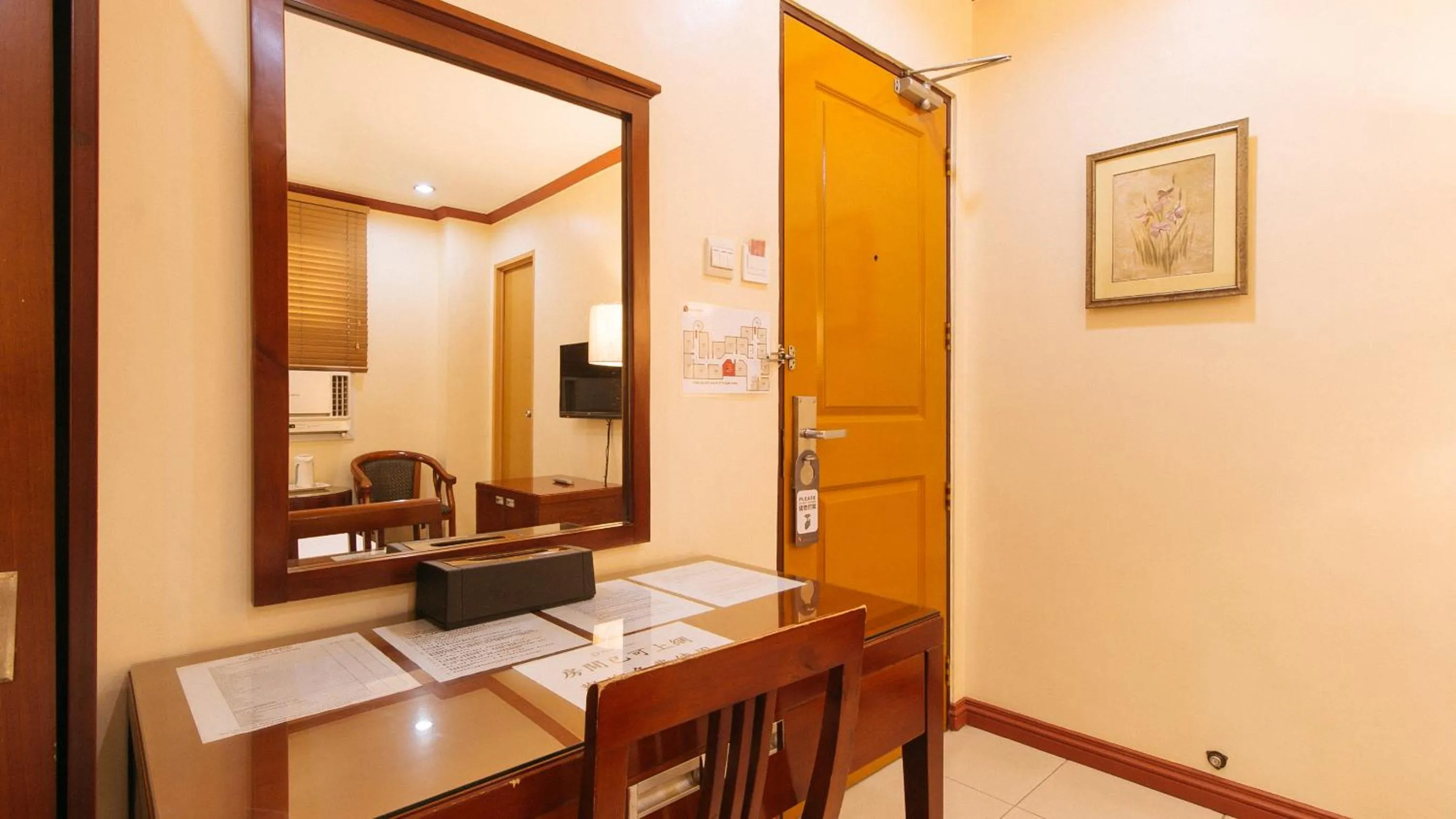 Seating area in Peace Hotel by RedDoorz