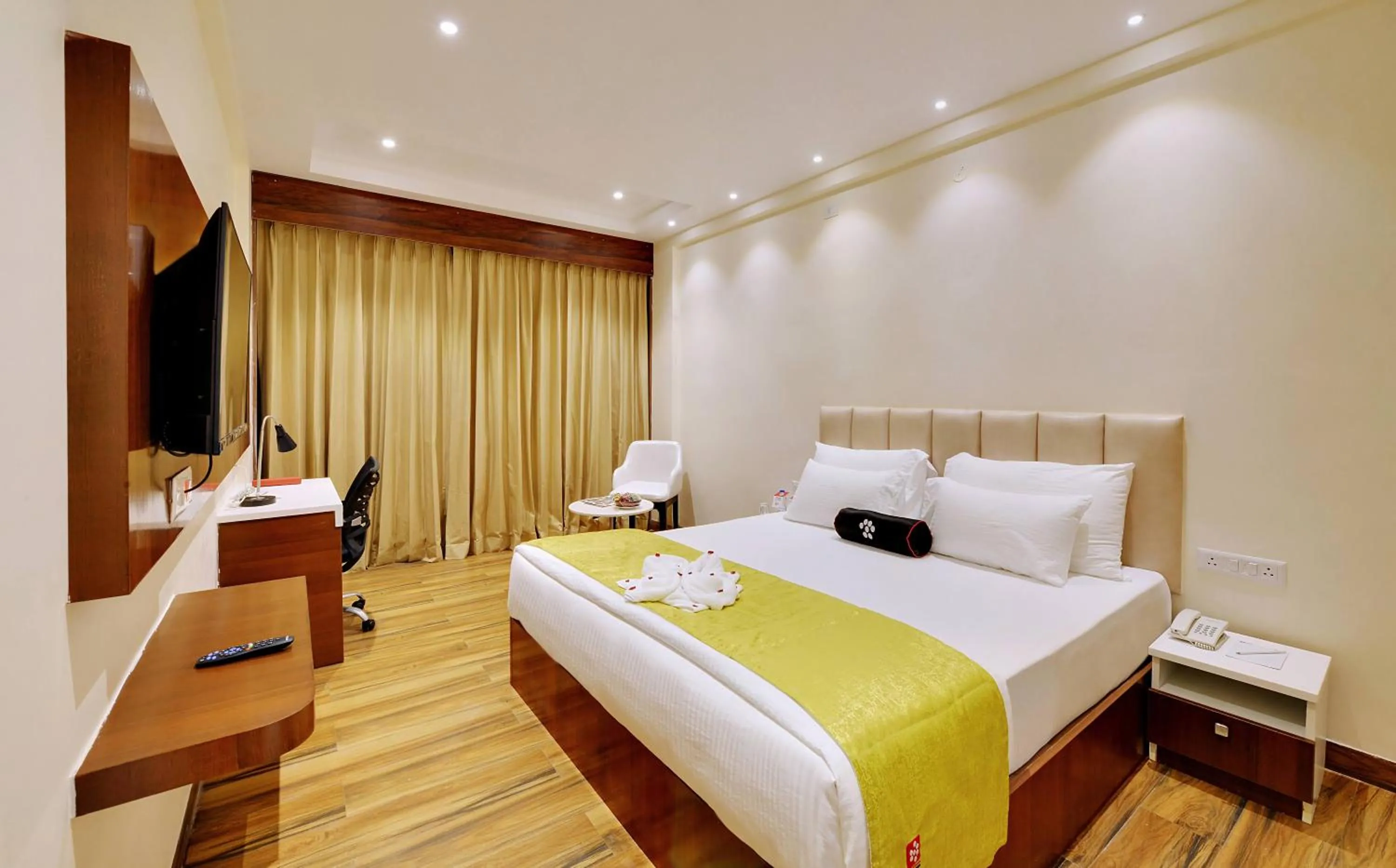 Bed in Mastiff Select Gulbarga Hotel