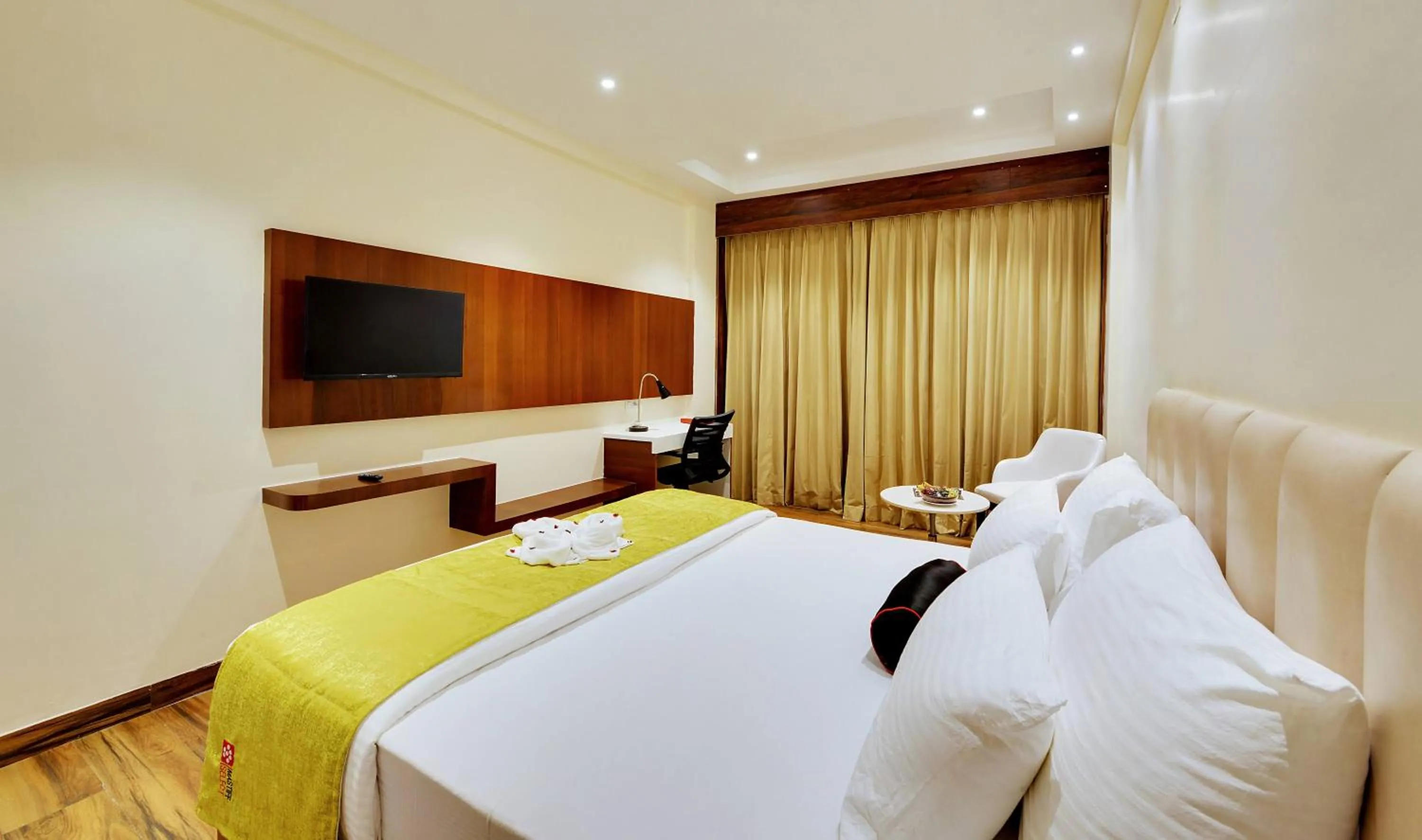 Bed in Mastiff Select Gulbarga Hotel