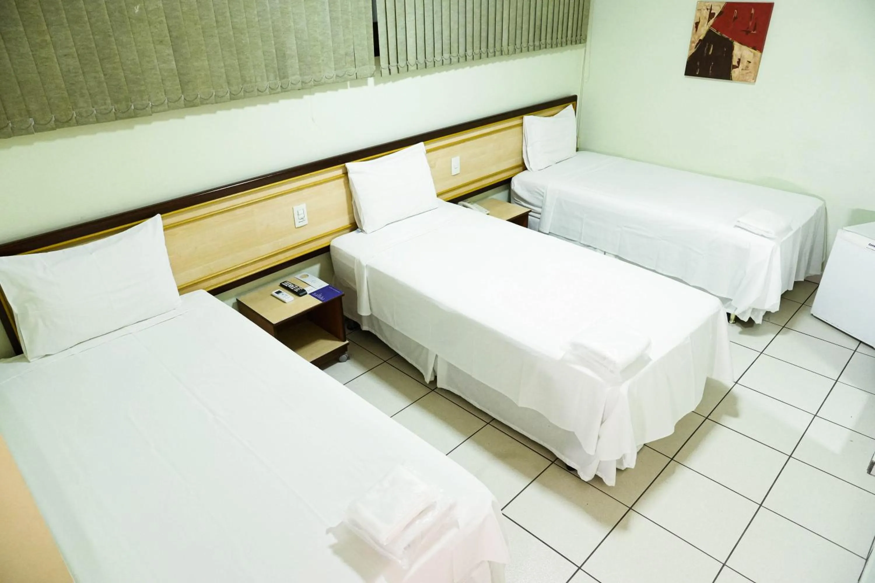 Bed in Larison Ji-Paraná by - Easy Hotéis