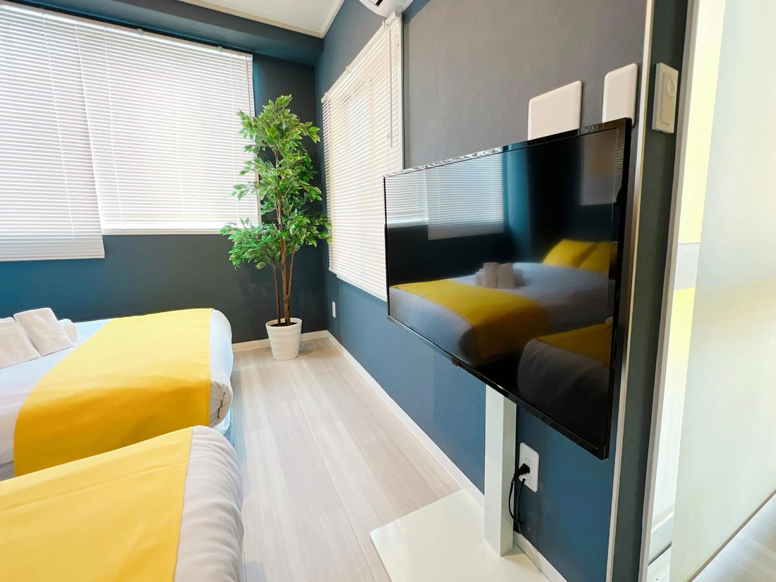 Bed in OUCHI HOTEL Nagarekawa with Dogs