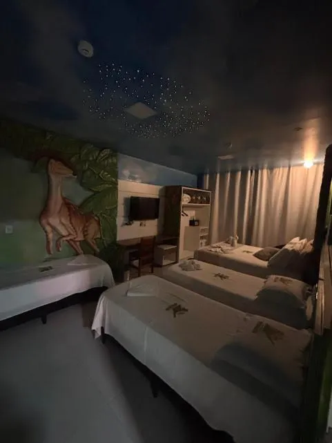 Bed in Hotel Recanto dos Dinossauros