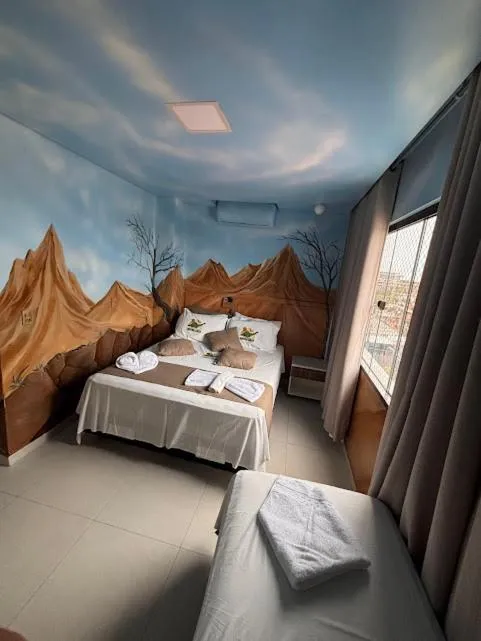 Bed in Hotel Recanto dos Dinossauros