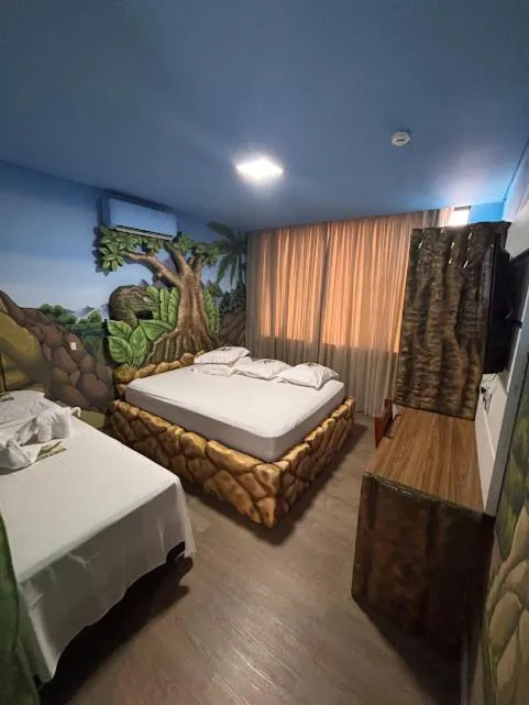Bed in Hotel Recanto dos Dinossauros