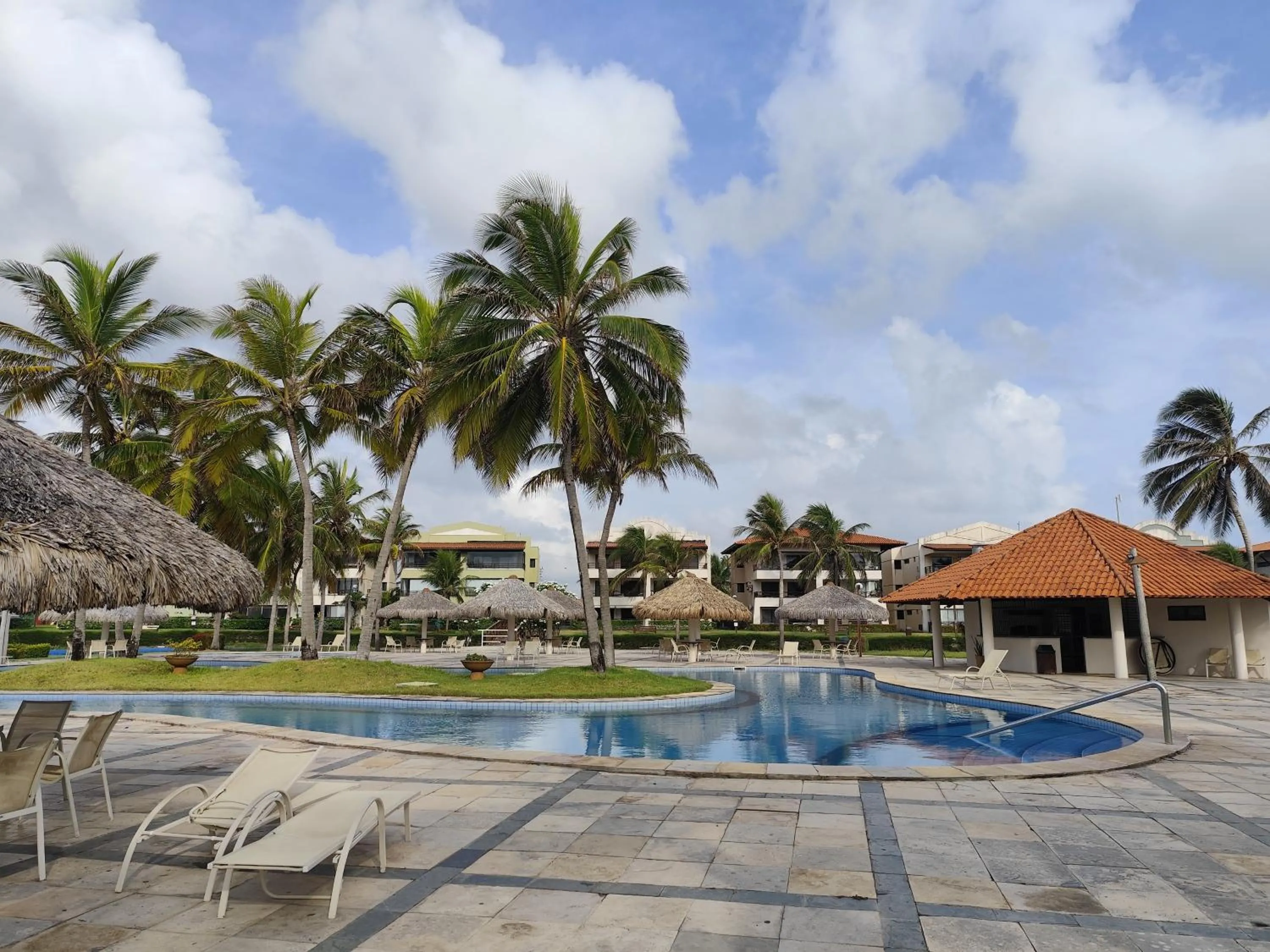 Swimming pool in Apartamento Aquaville Pé na areia e Água coco
