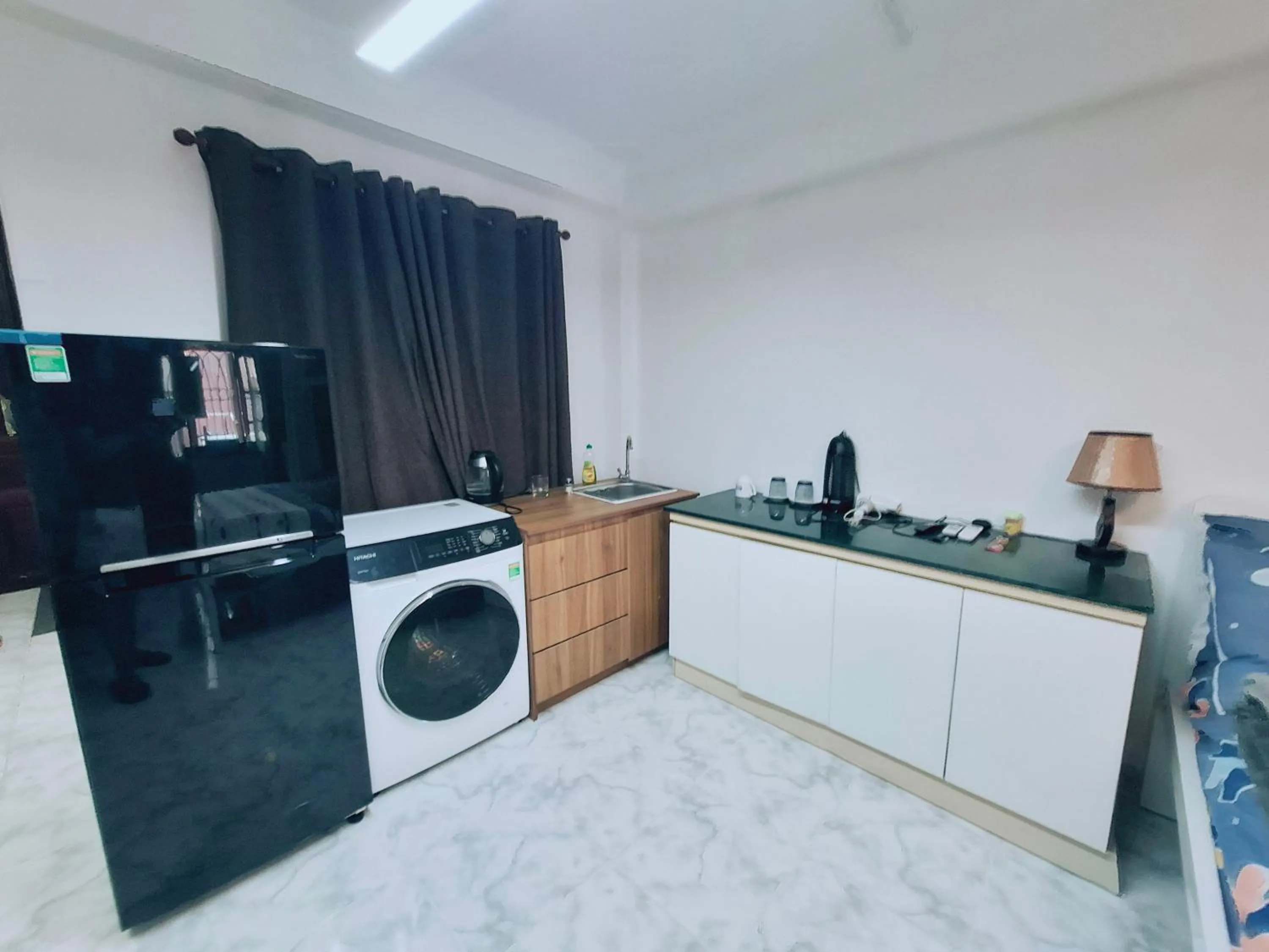Kitchen or kitchenette in Homestay Hostel Apartment Minh Lộc