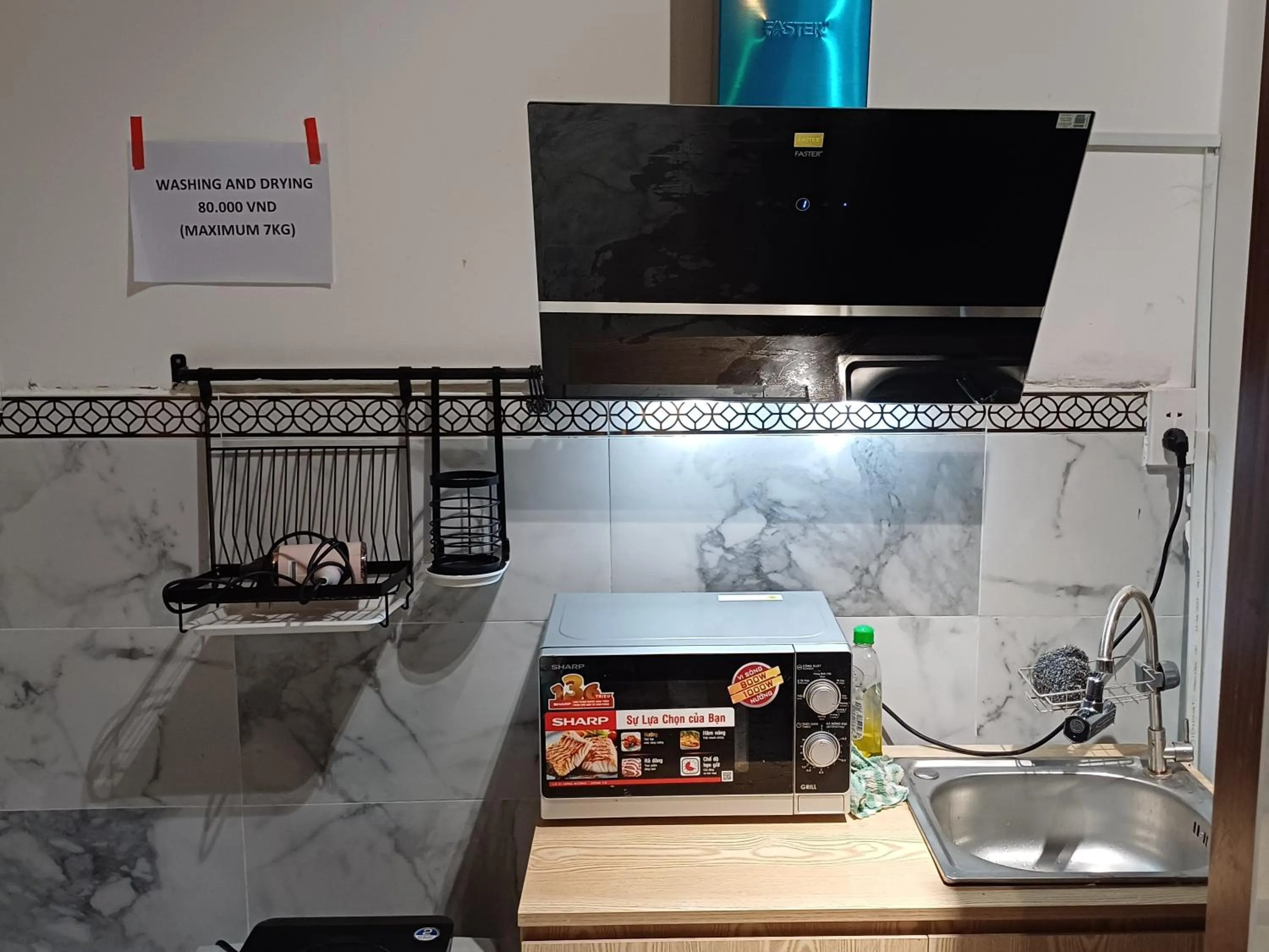 Kitchen or kitchenette in Homestay Hostel Apartment Minh Lộc