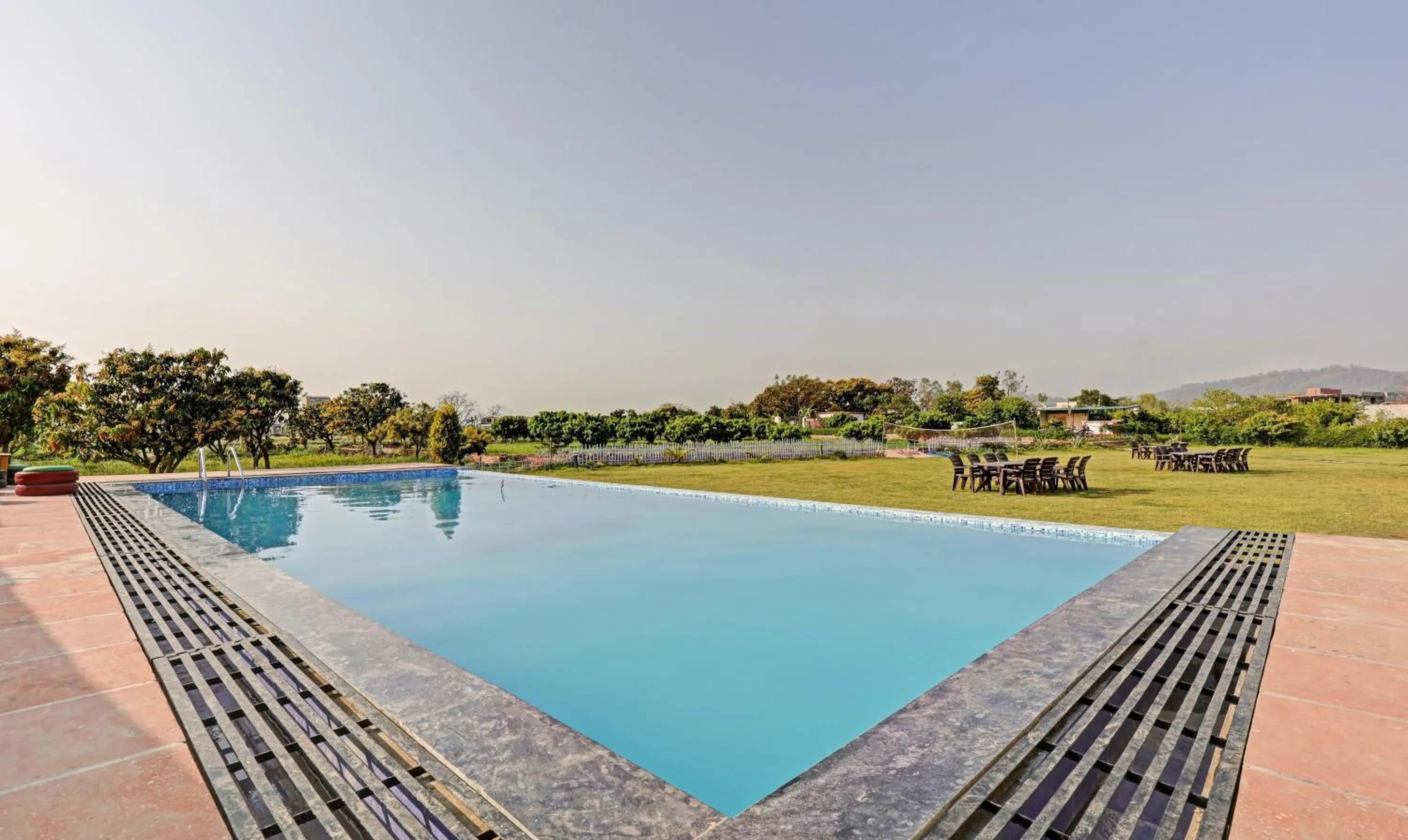 Swimming pool in Treebo Kaira Resort With Pool View, 5 Km From Jim Corbett Jungle Safari