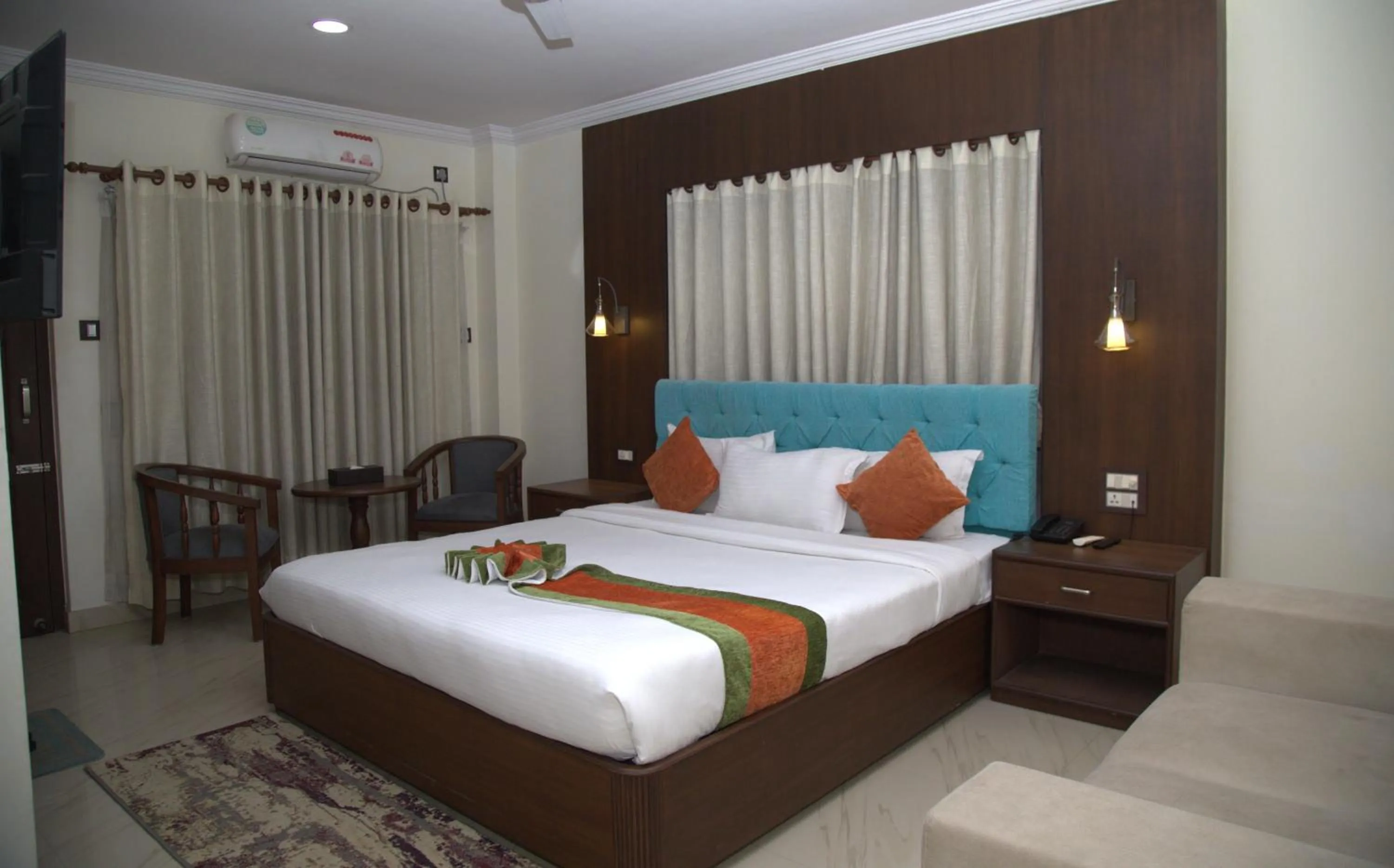 Bed in Gautam Buddha International Hotel