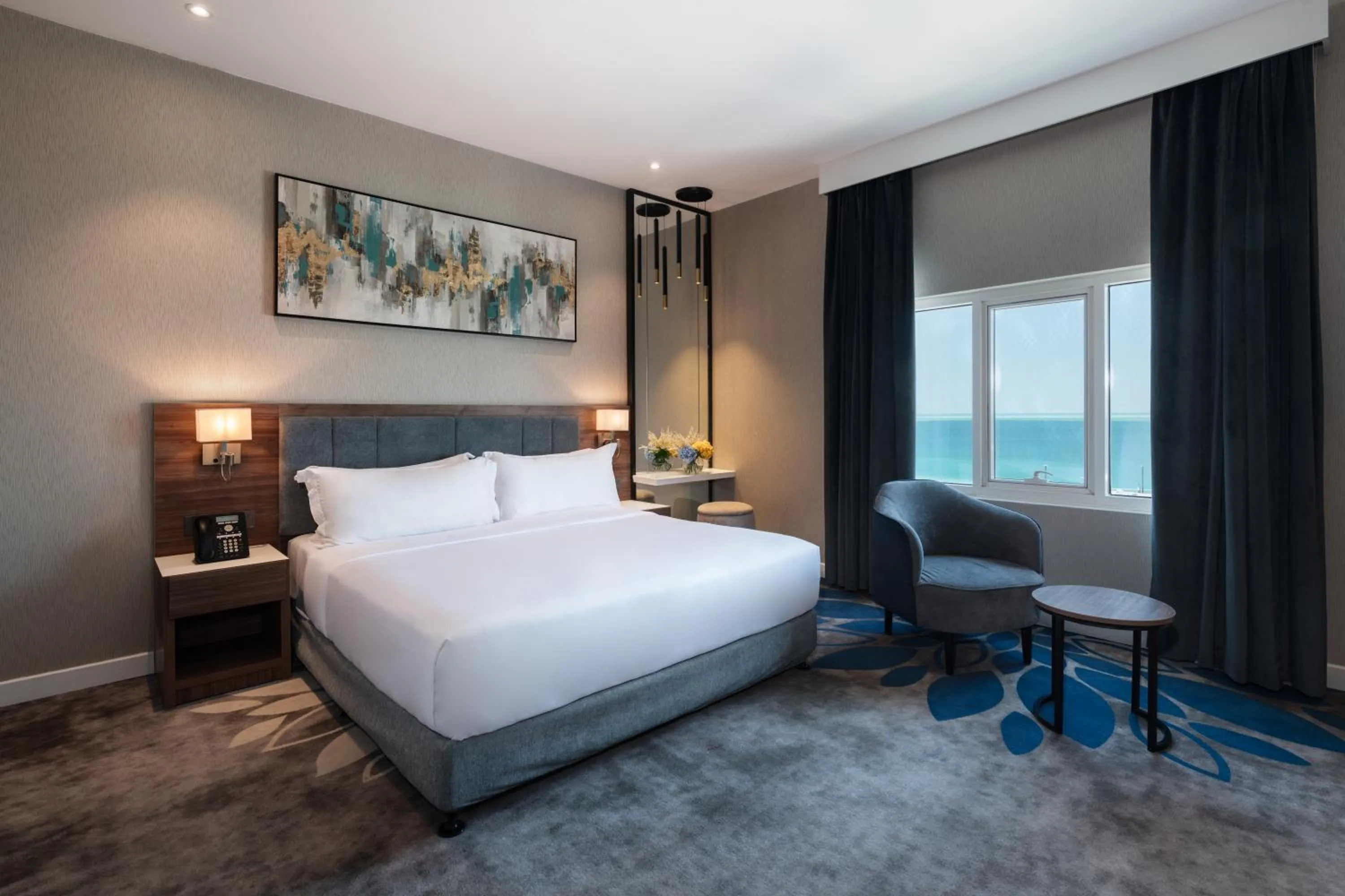 Seating area, Bed in Warwick Al Jubail Hotel