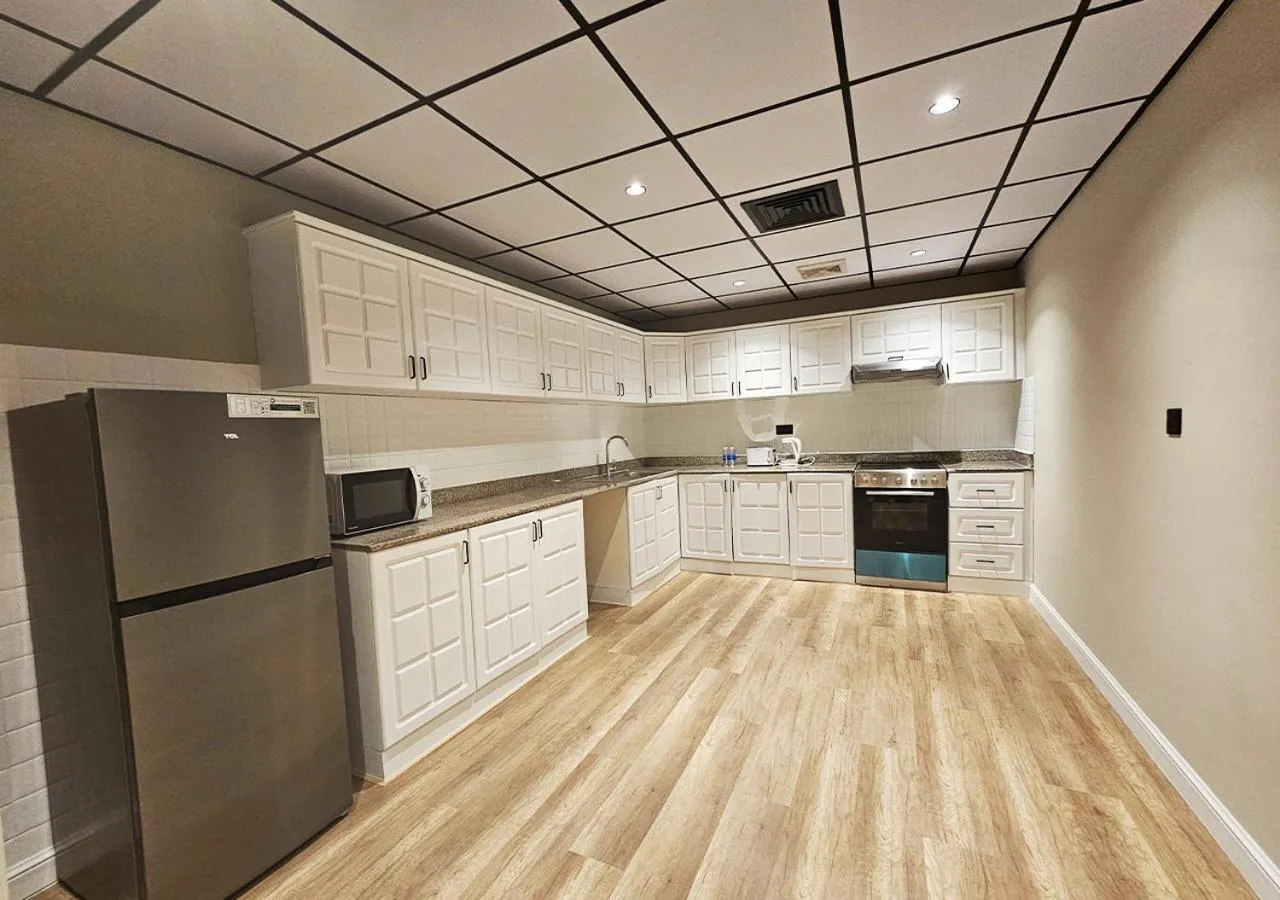 Kitchen or kitchenette in Al Faris Suites 2