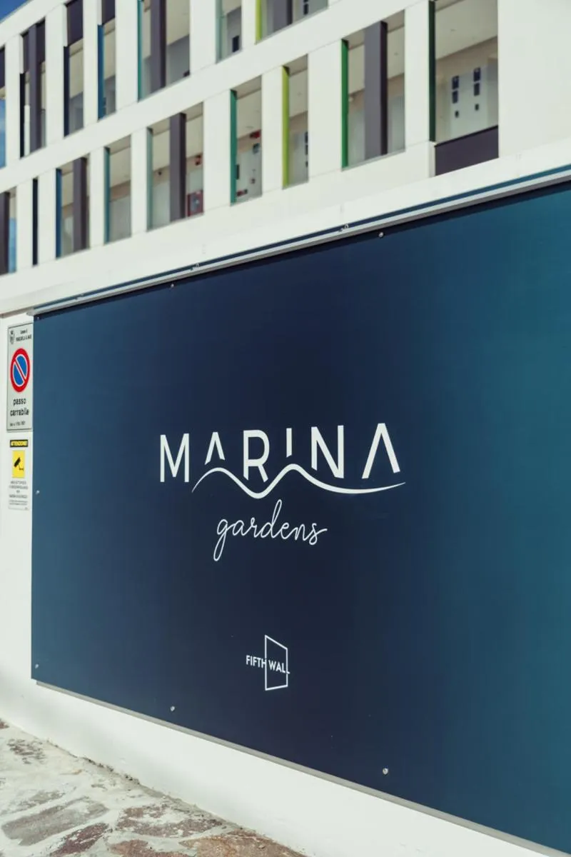 Property logo or sign in Marina Gardens Boutique&Suites