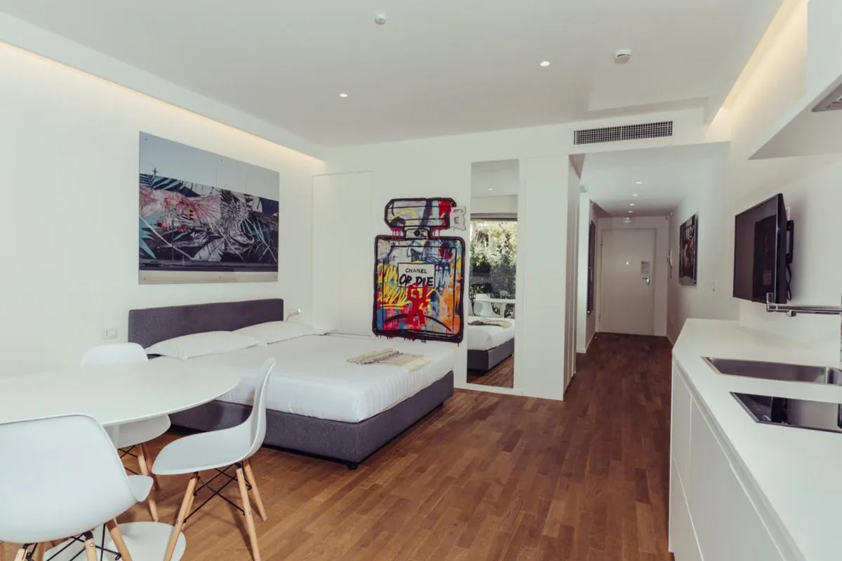 Communal lounge/ TV room, Bed in Marina Gardens Boutique&Suites