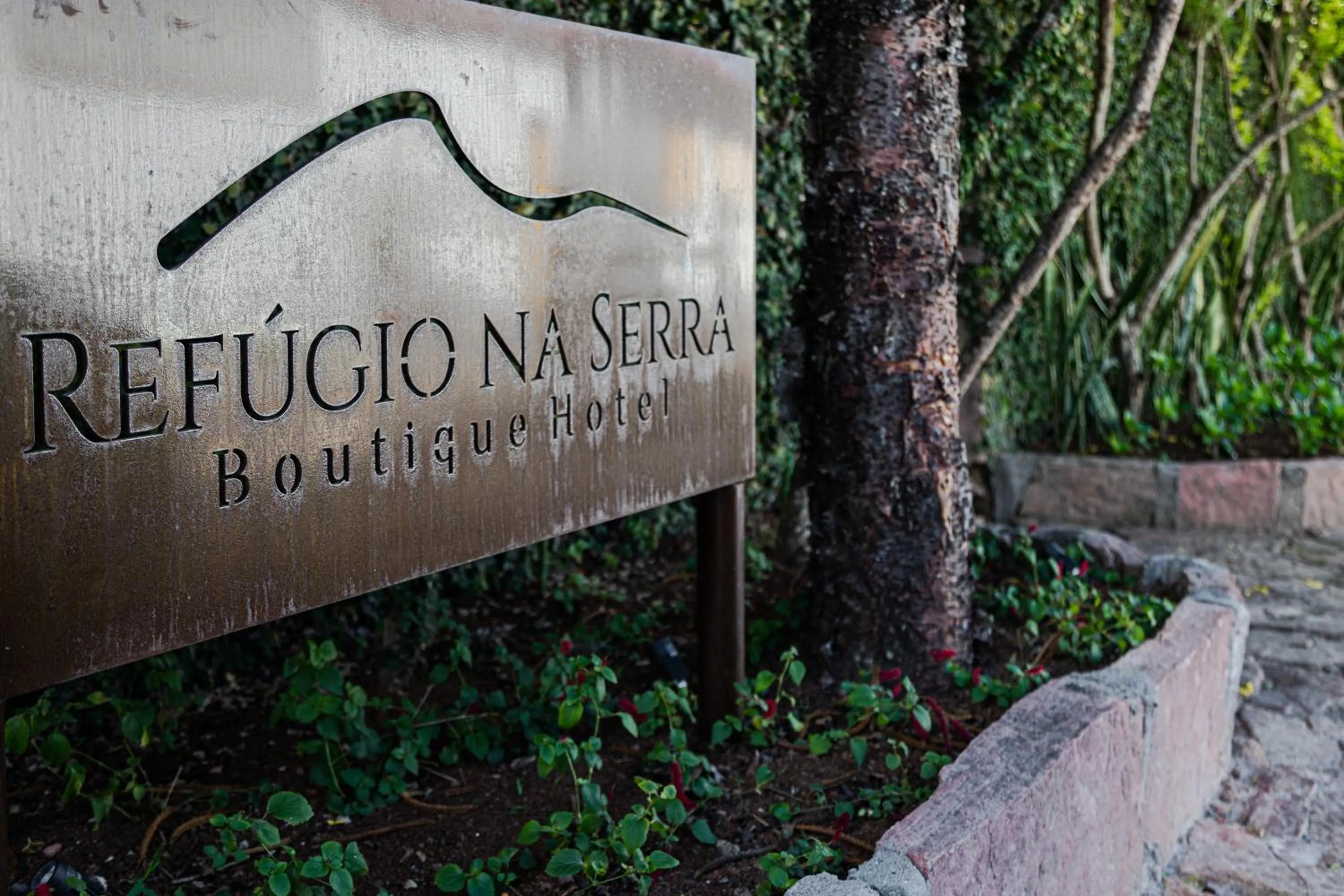 Property logo or sign in Refúgio na Serra Boutique Hotel