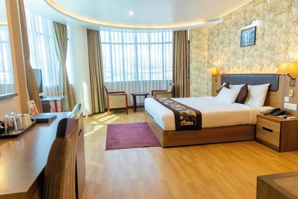 Bed in Hotel Mirage Regency