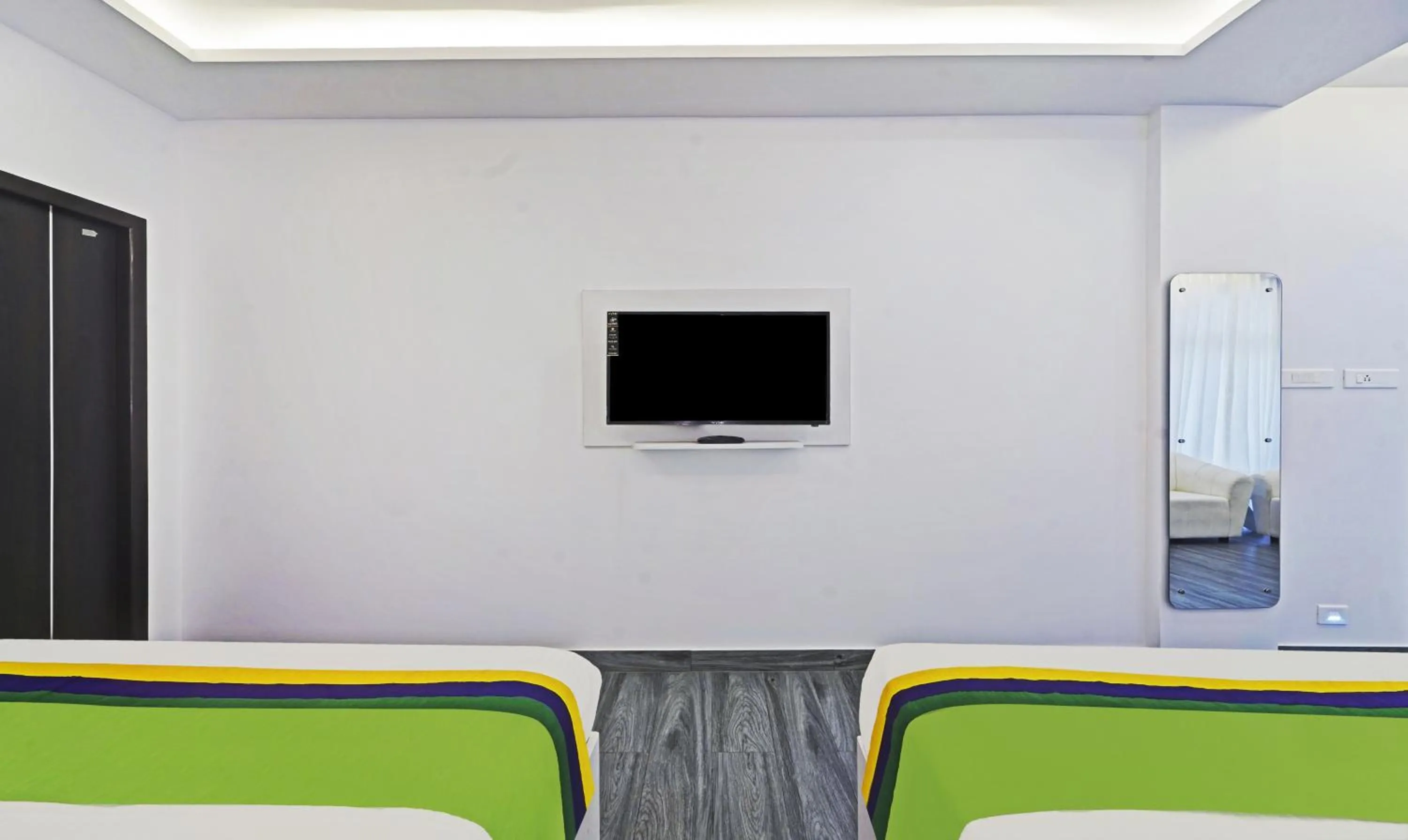 Bed in Treebo Premium Raffis' Andalusia Bay Way