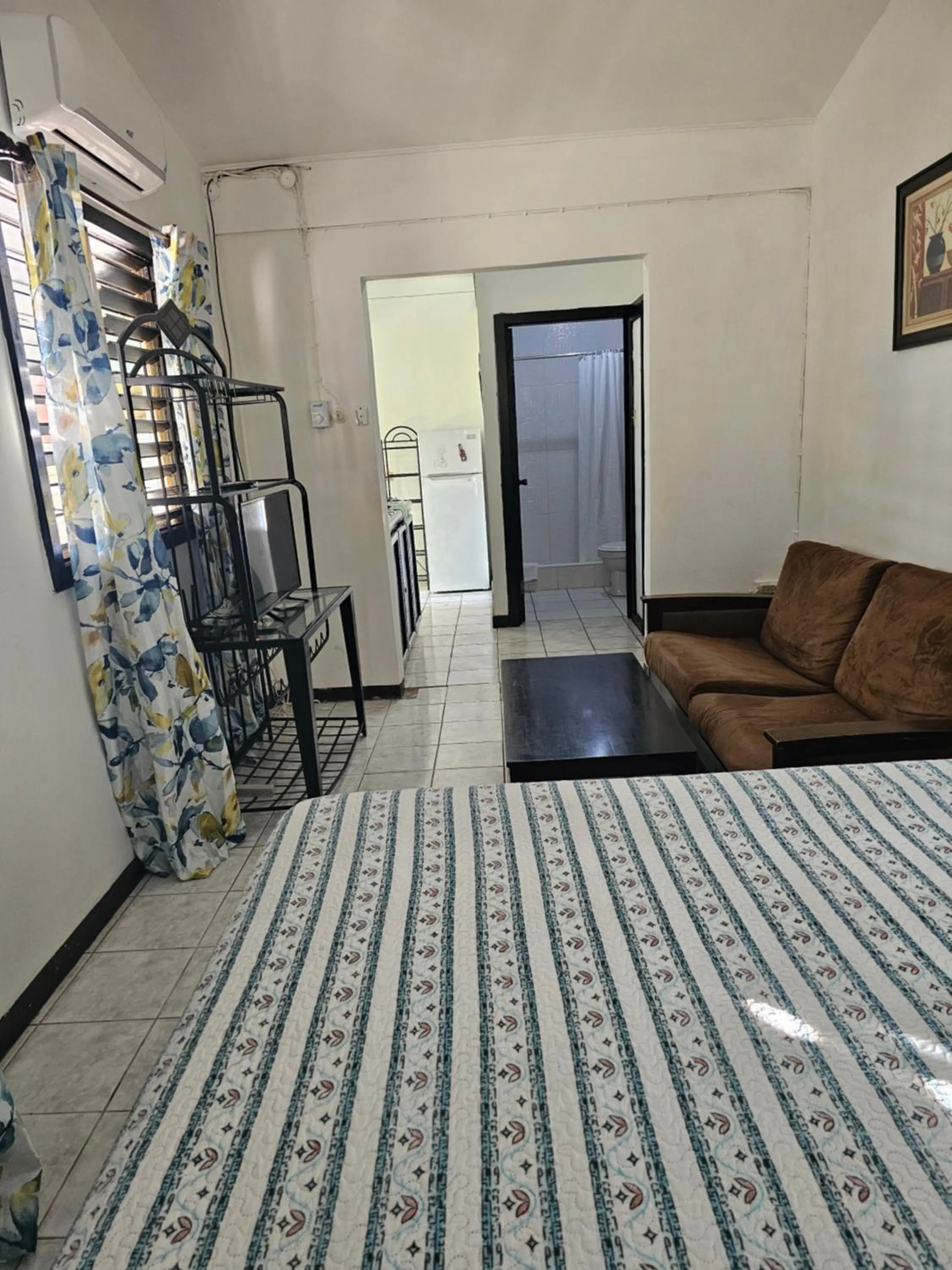 Photo of the whole room, Bed in Roots Cafe Rooms