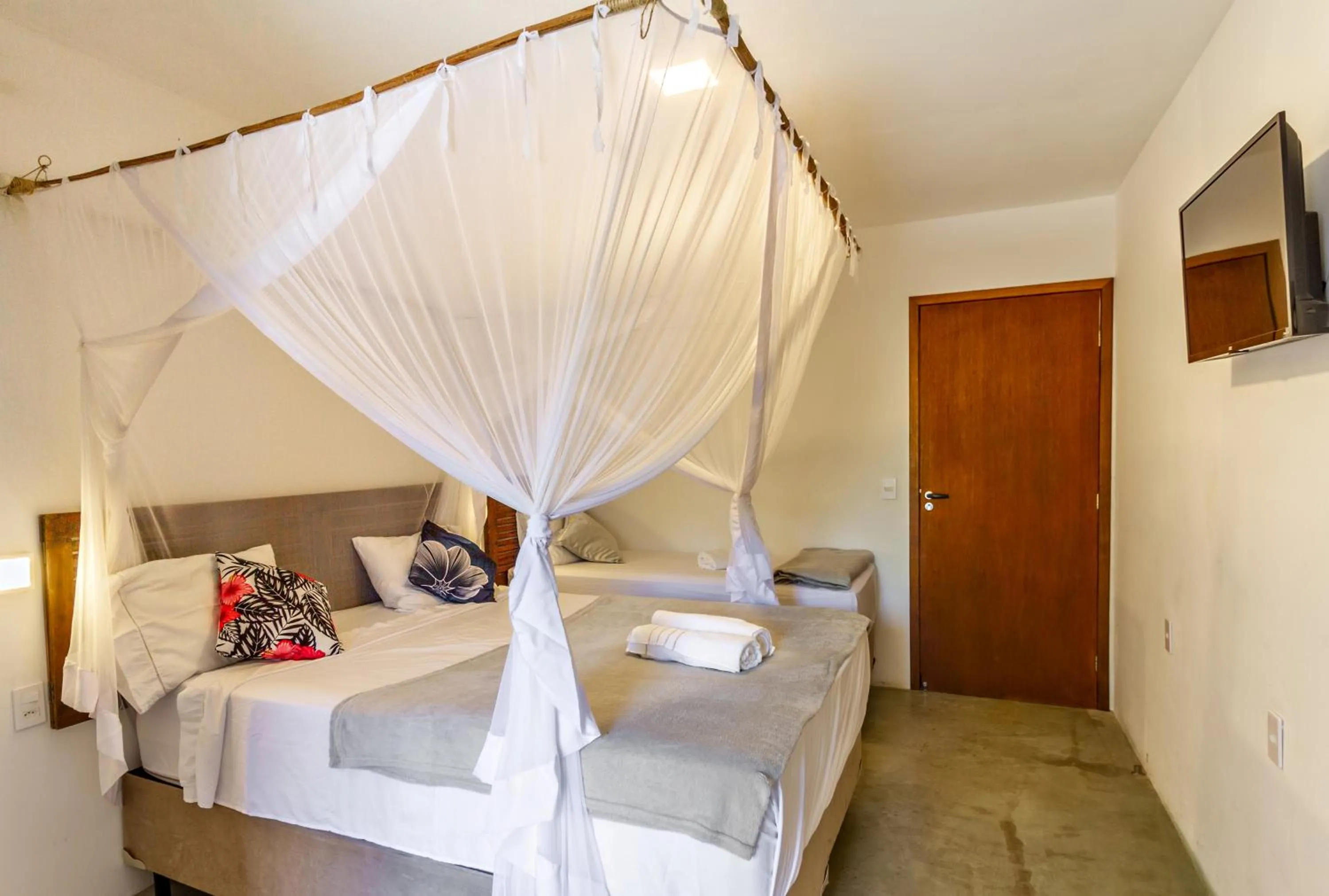 Bed in Pousada Imperador do Espelho