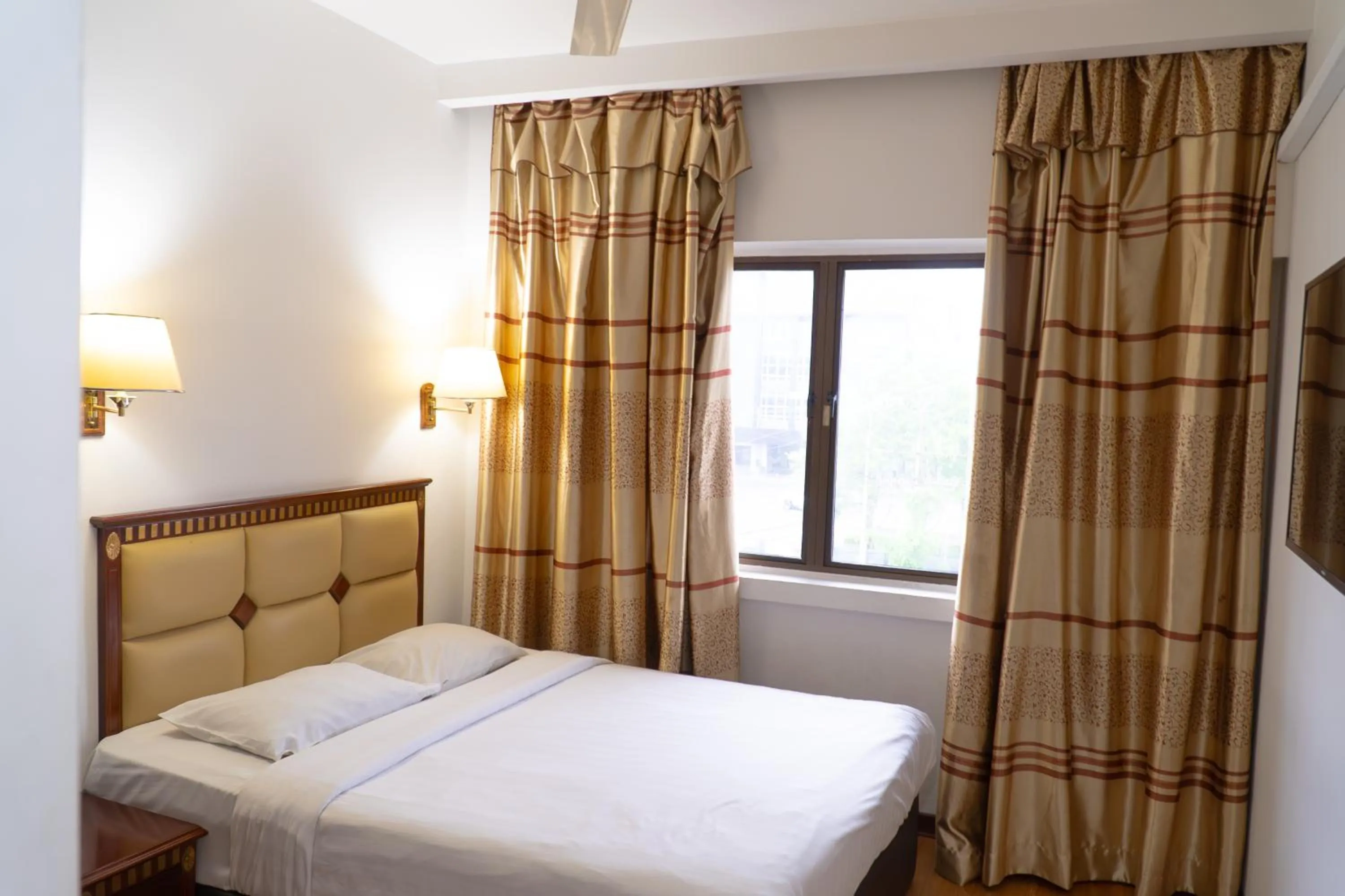 Bed in Borneo Suites Hotel