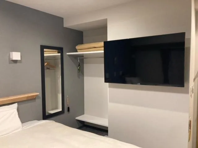 Bed in Station Hotel Nagasaki Suwa