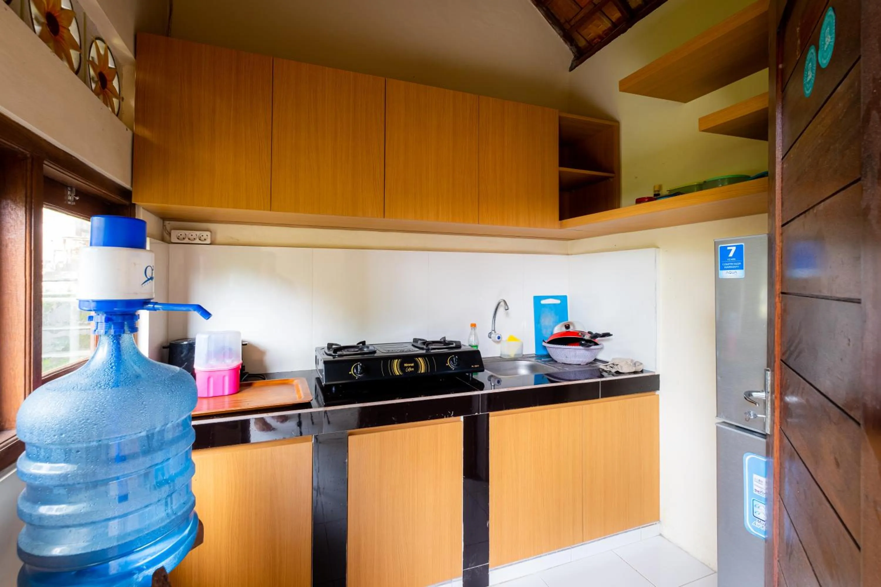 Kitchen or kitchenette in Suweta Homestay with Private Pool by Supala