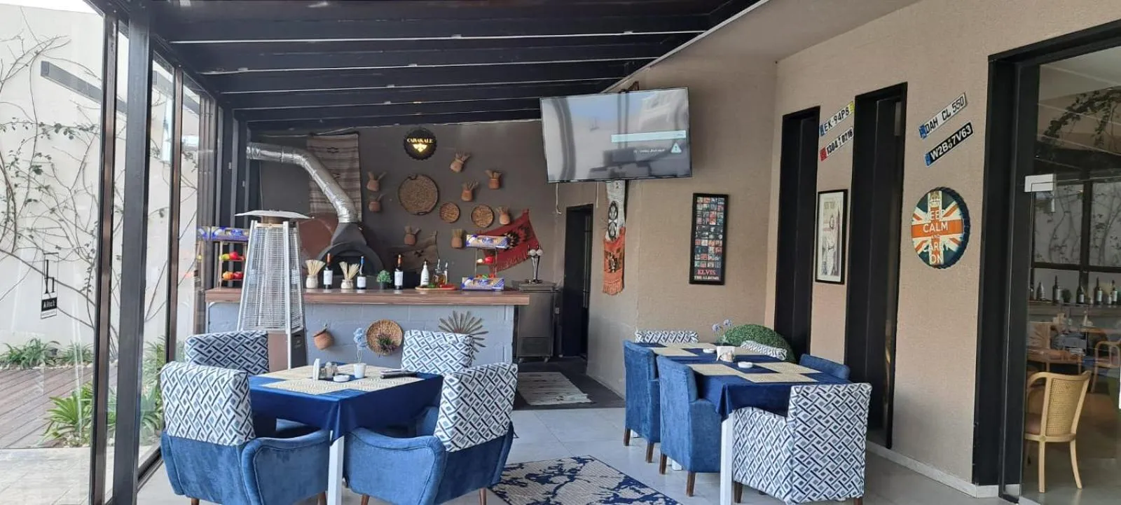 Communal lounge/ TV room in Aitch Boutique Hotel - an LIH Hotel