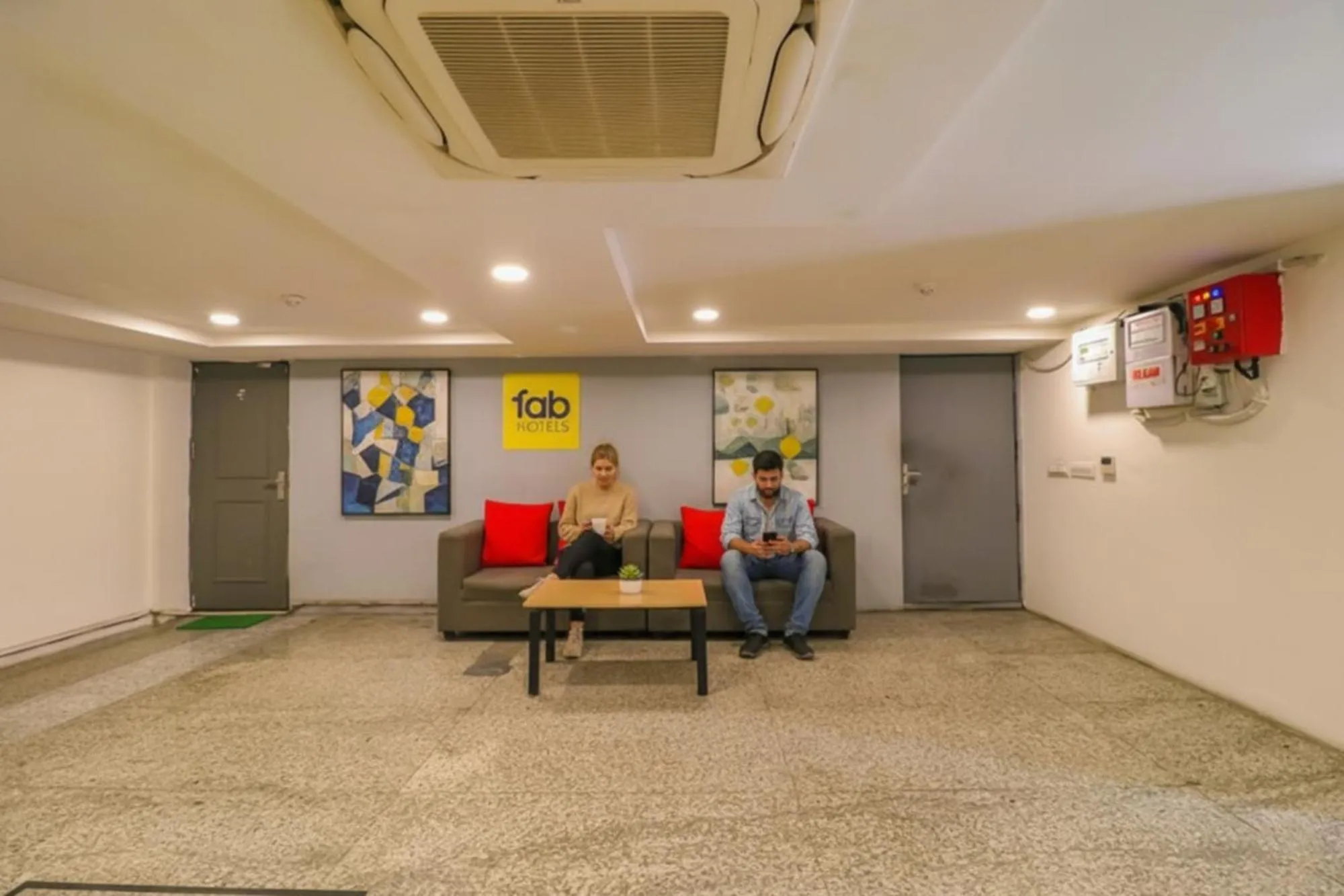 Seating area in FabHotel La Serene Punjabi Bagh