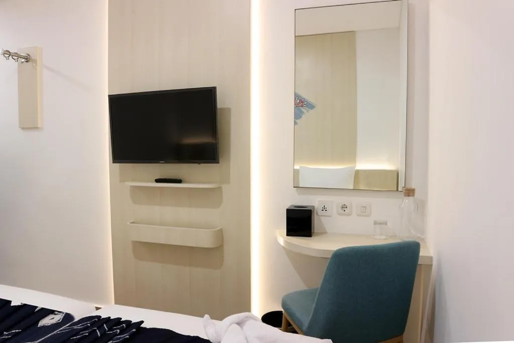 Communal lounge/ TV room, Bed in Cordia Hotel Banjarmasin - Hotel Dalam Bandara