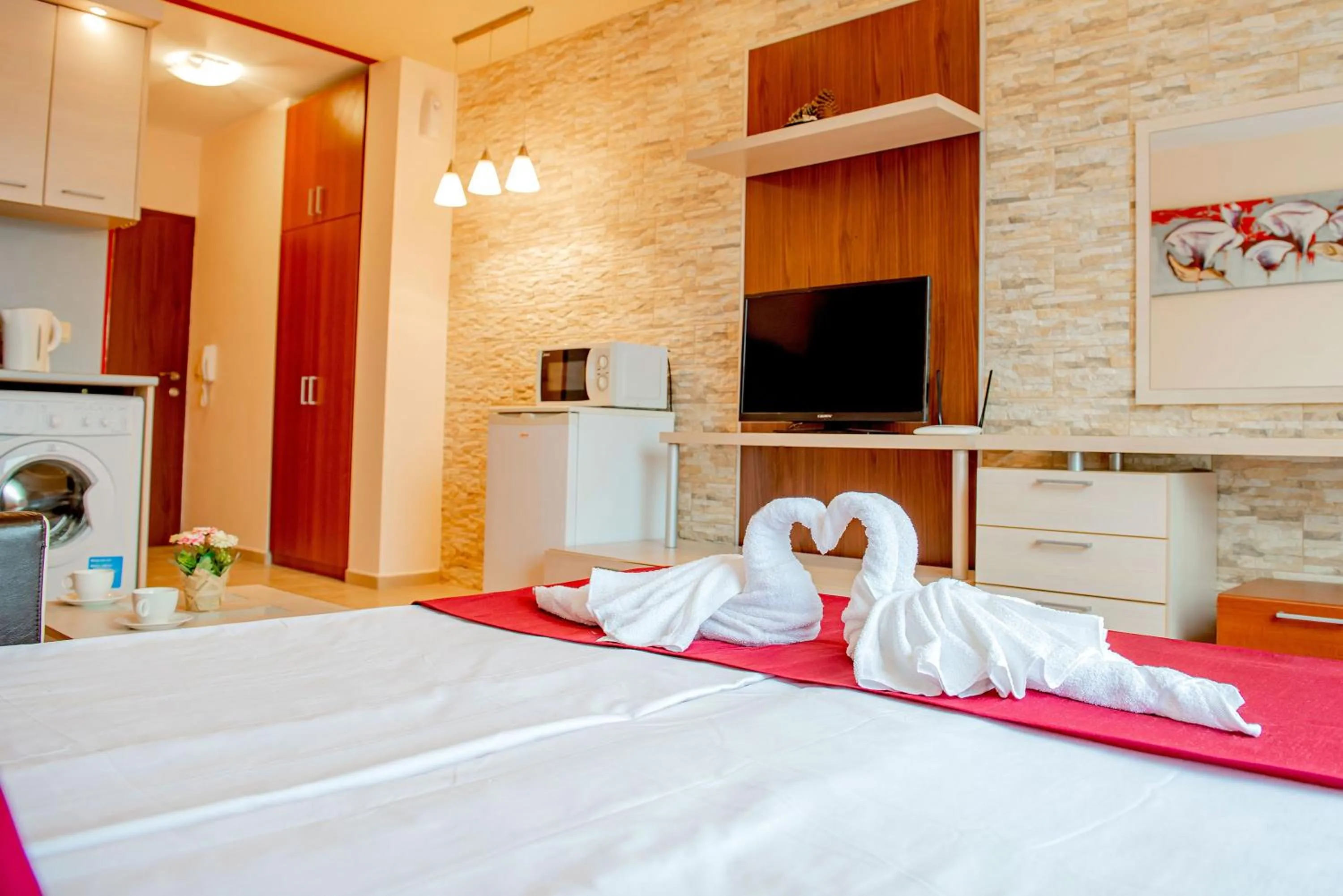 Communal lounge/ TV room, Bed in Green Life Beach Resort Apartment