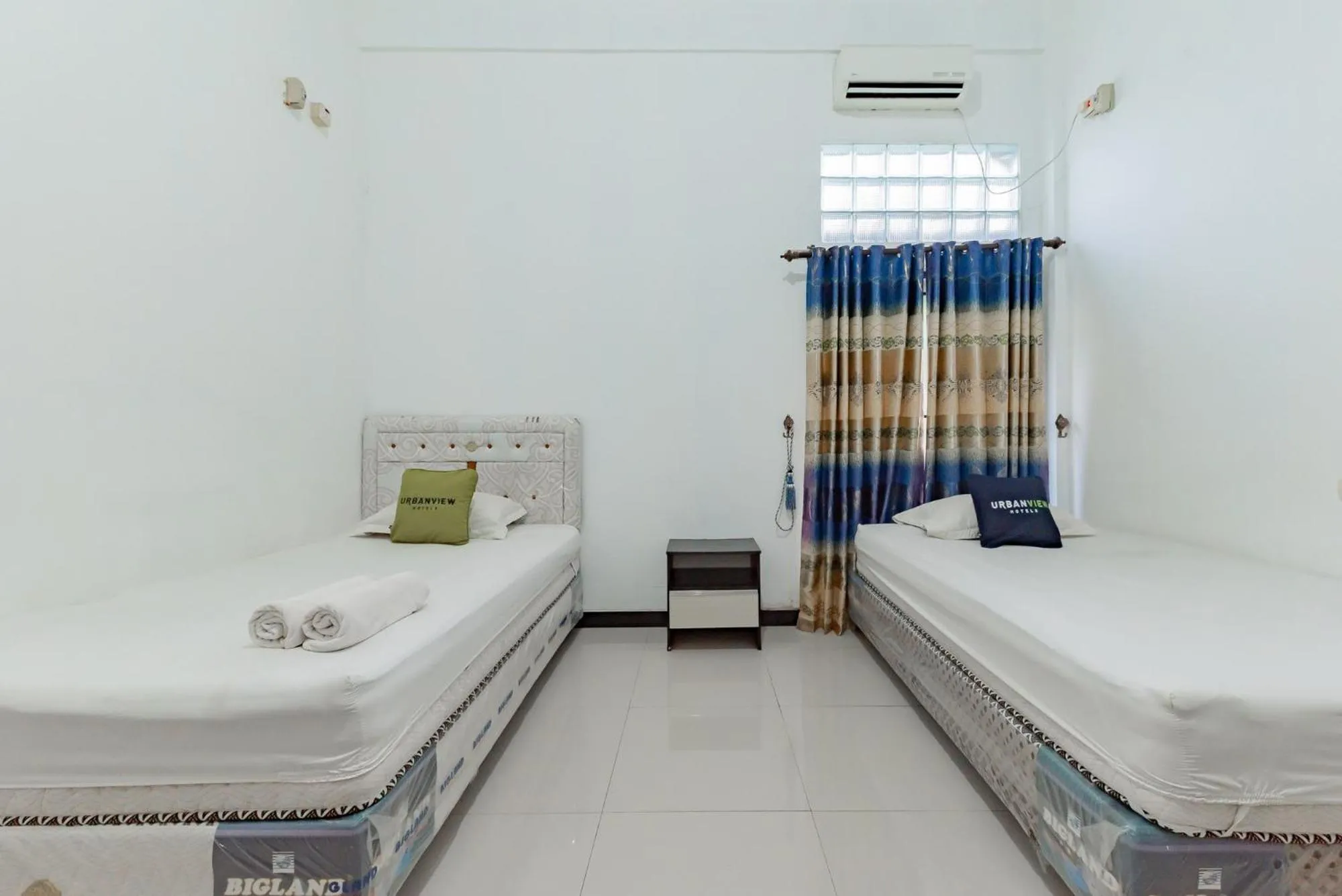 Bed in Urbanview Hotel Syariah 99 Banjarbaru by RedDoorz