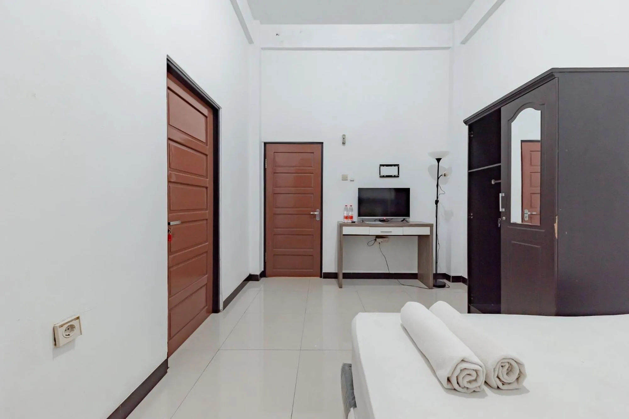 Bed in Urbanview Hotel Syariah 99 Banjarbaru by RedDoorz