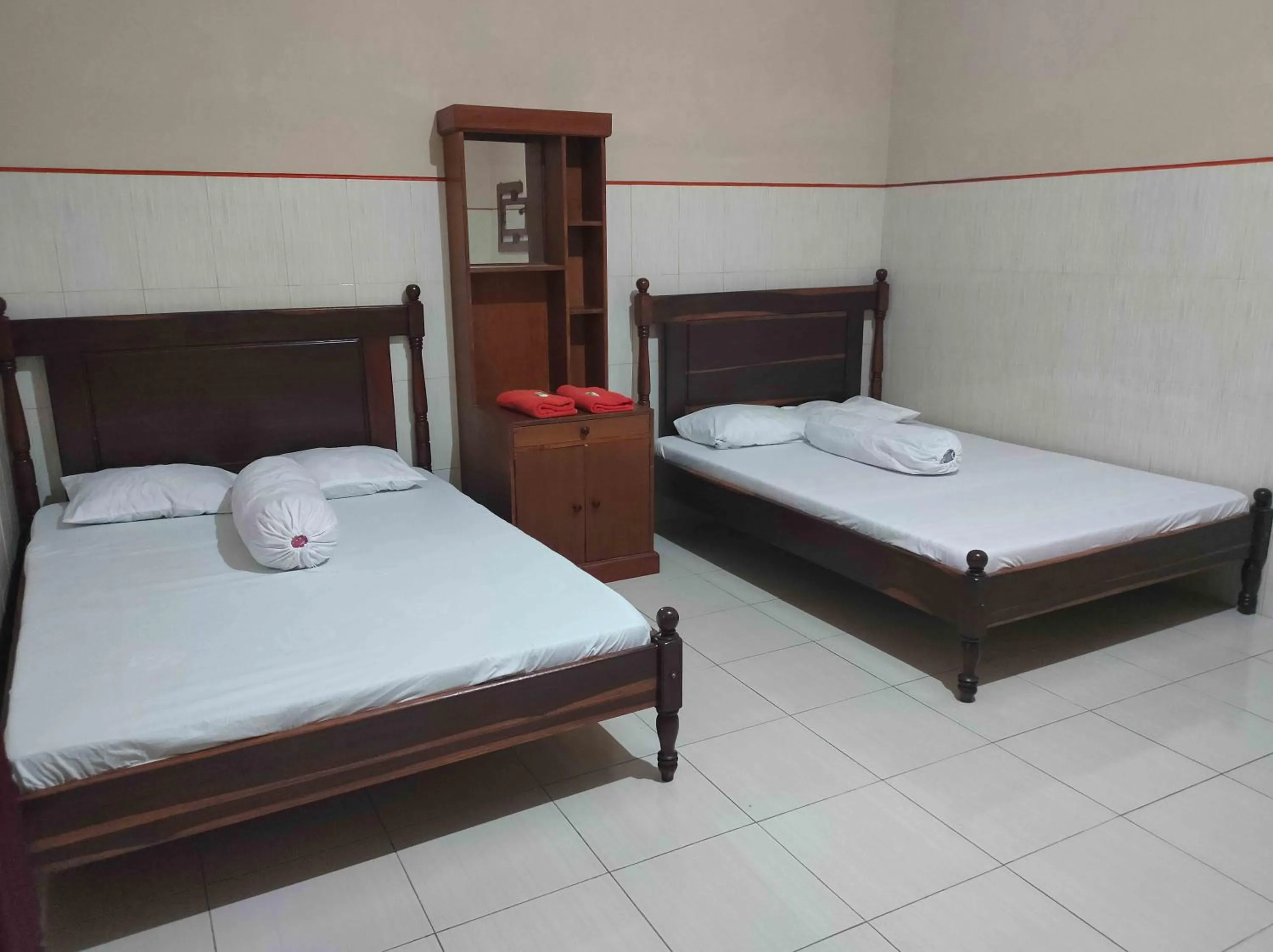 Bed in Penginapan Mentorogo Kaliurang Mitra RedDoorz