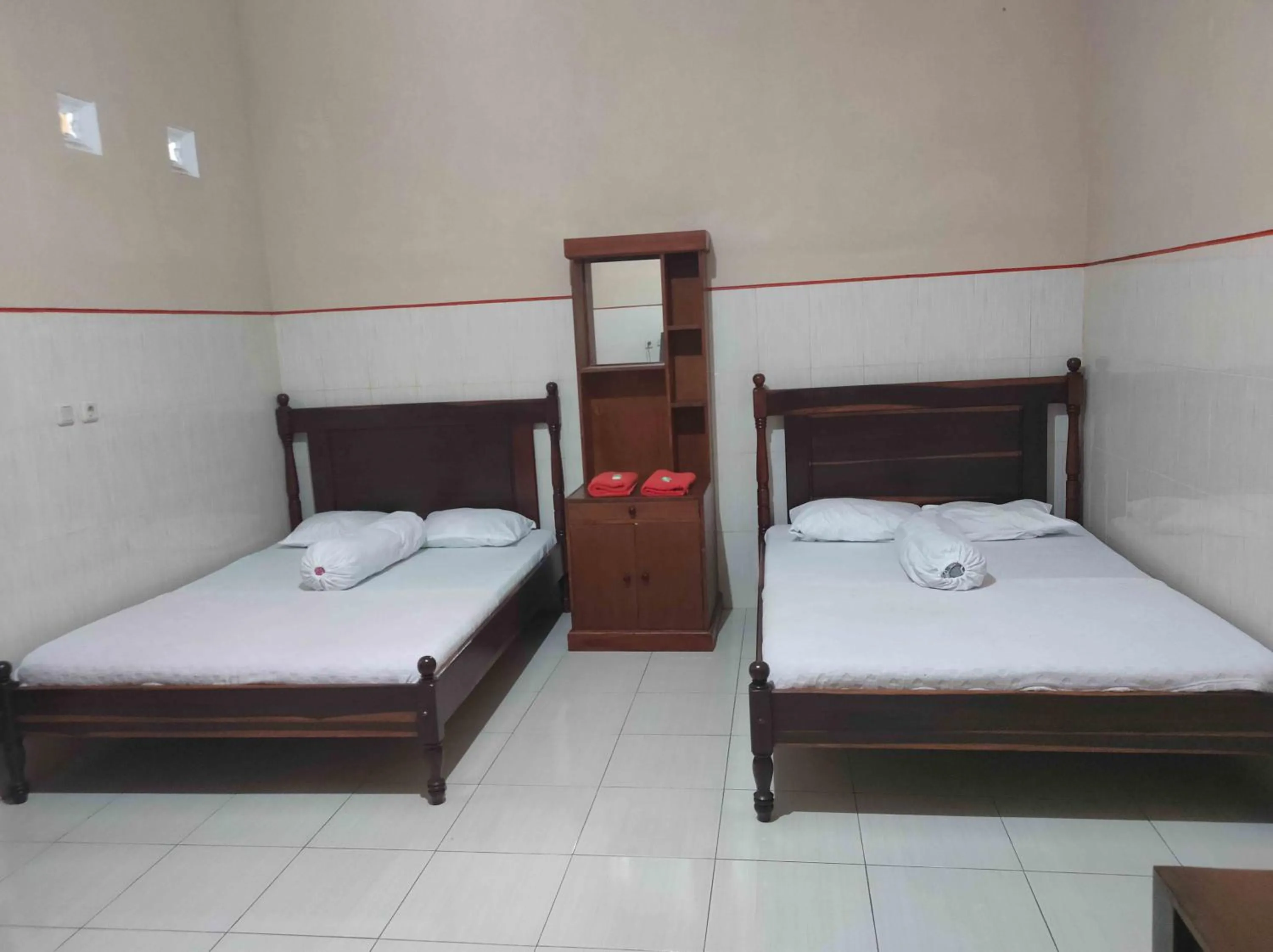 Bed in Penginapan Mentorogo Kaliurang Mitra RedDoorz