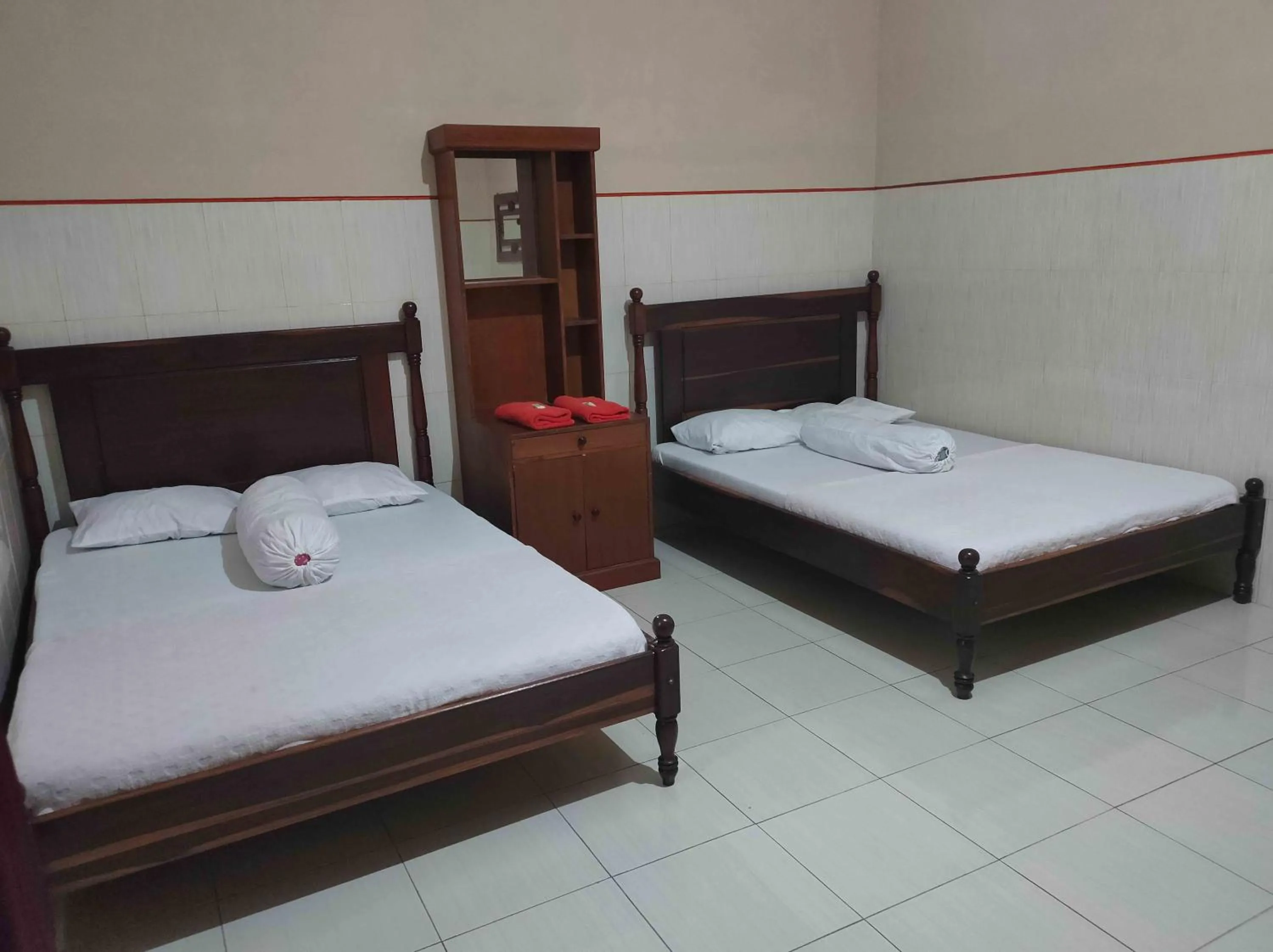 Bed in Penginapan Mentorogo Kaliurang Mitra RedDoorz
