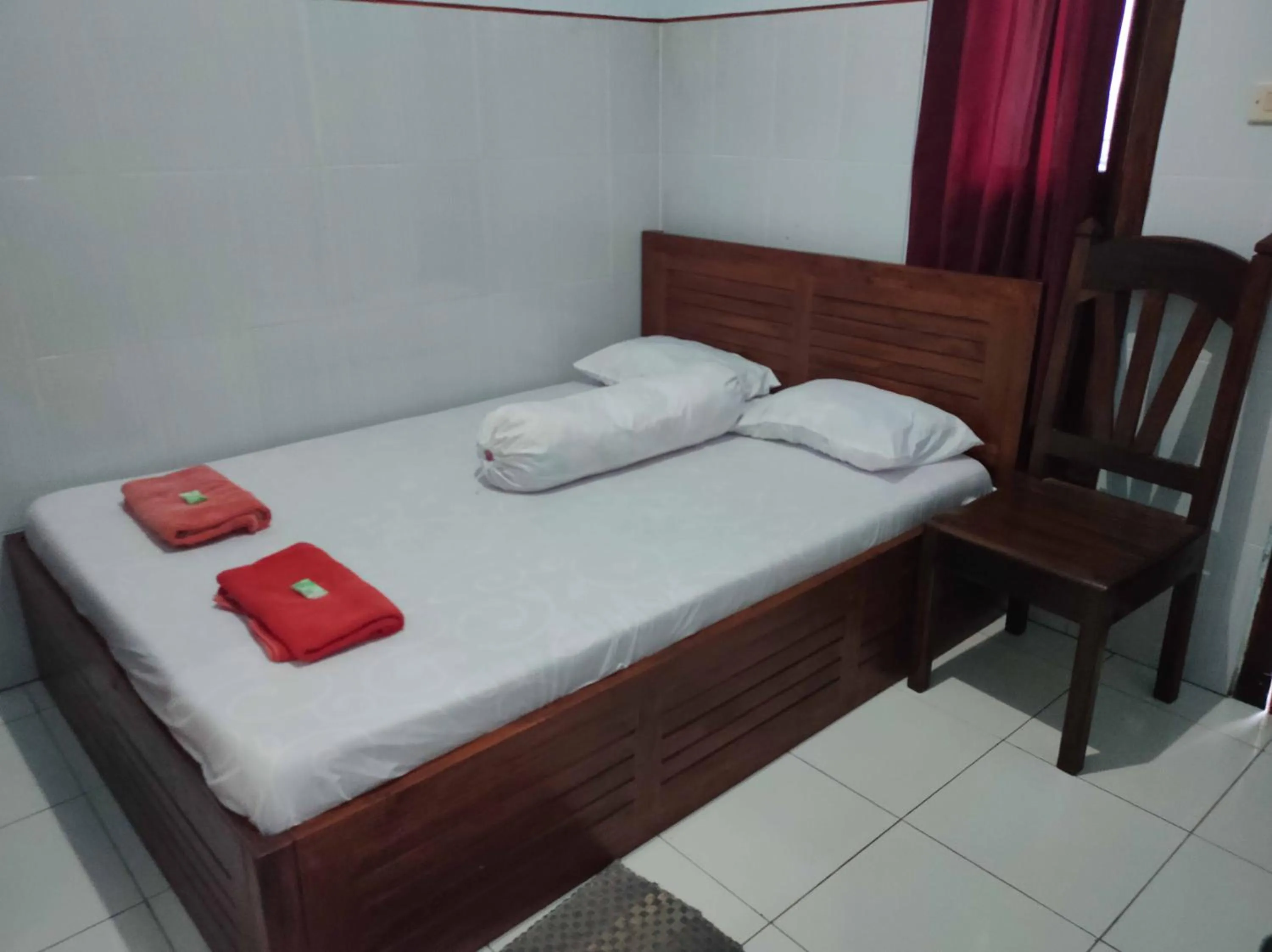 Bed in Penginapan Mentorogo Kaliurang Mitra RedDoorz