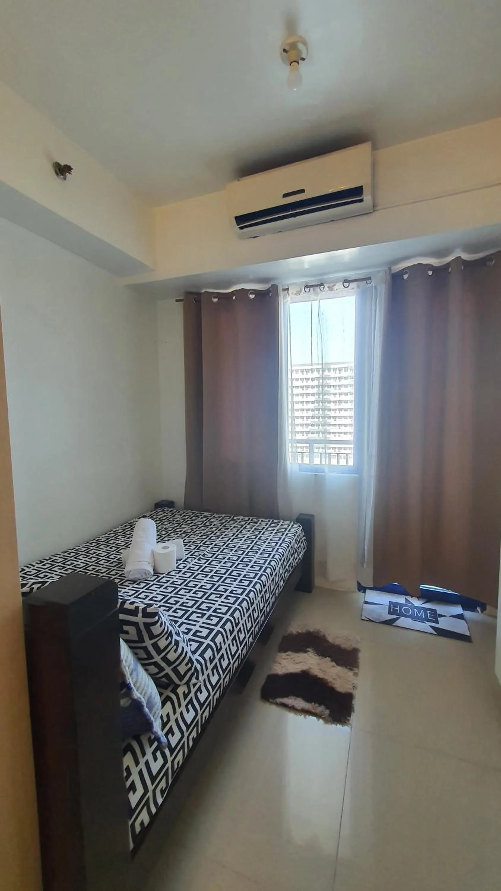 Bed in Sea Residences by EZ Stays