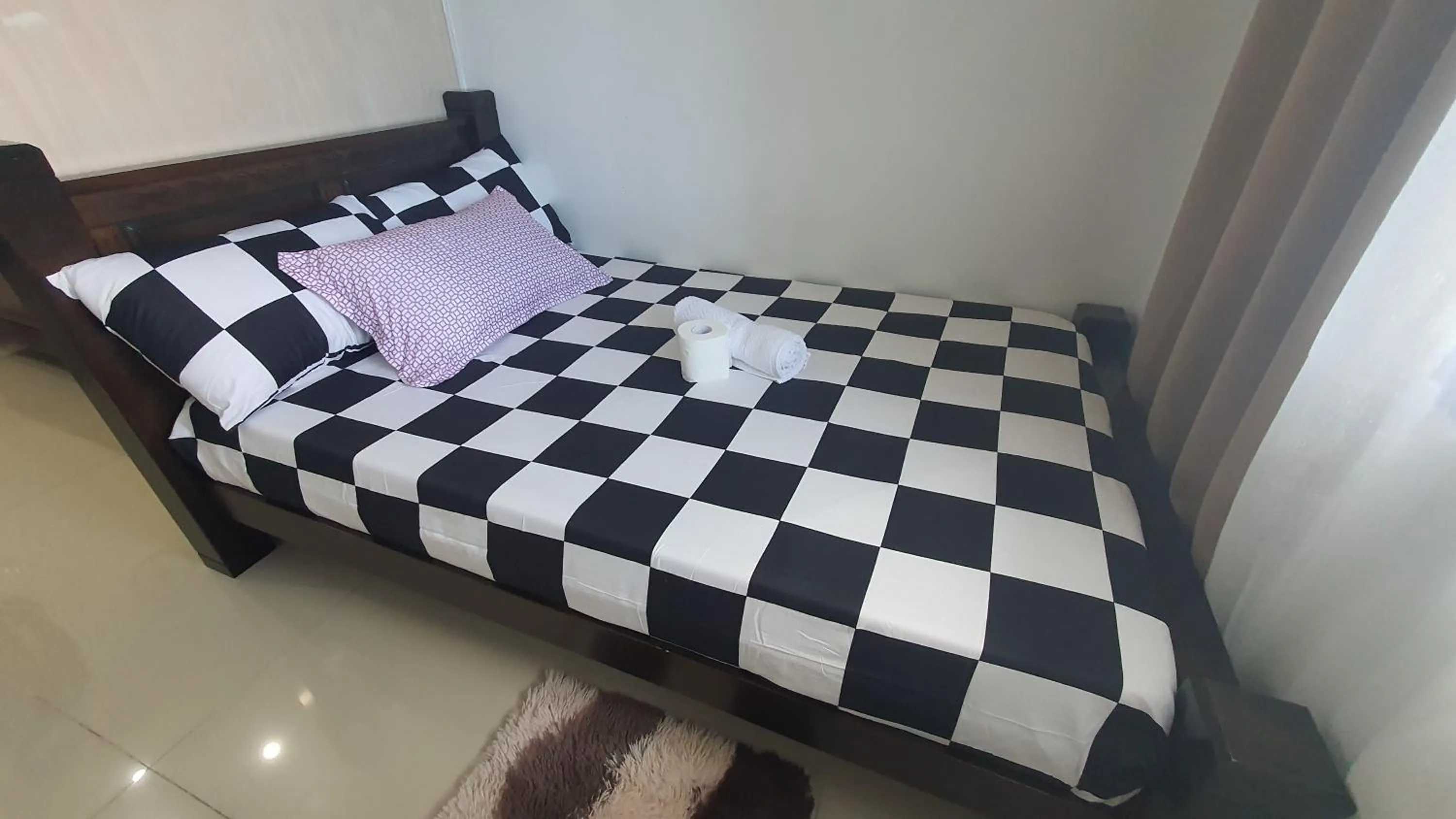 Bed in Sea Residences by EZ Stays