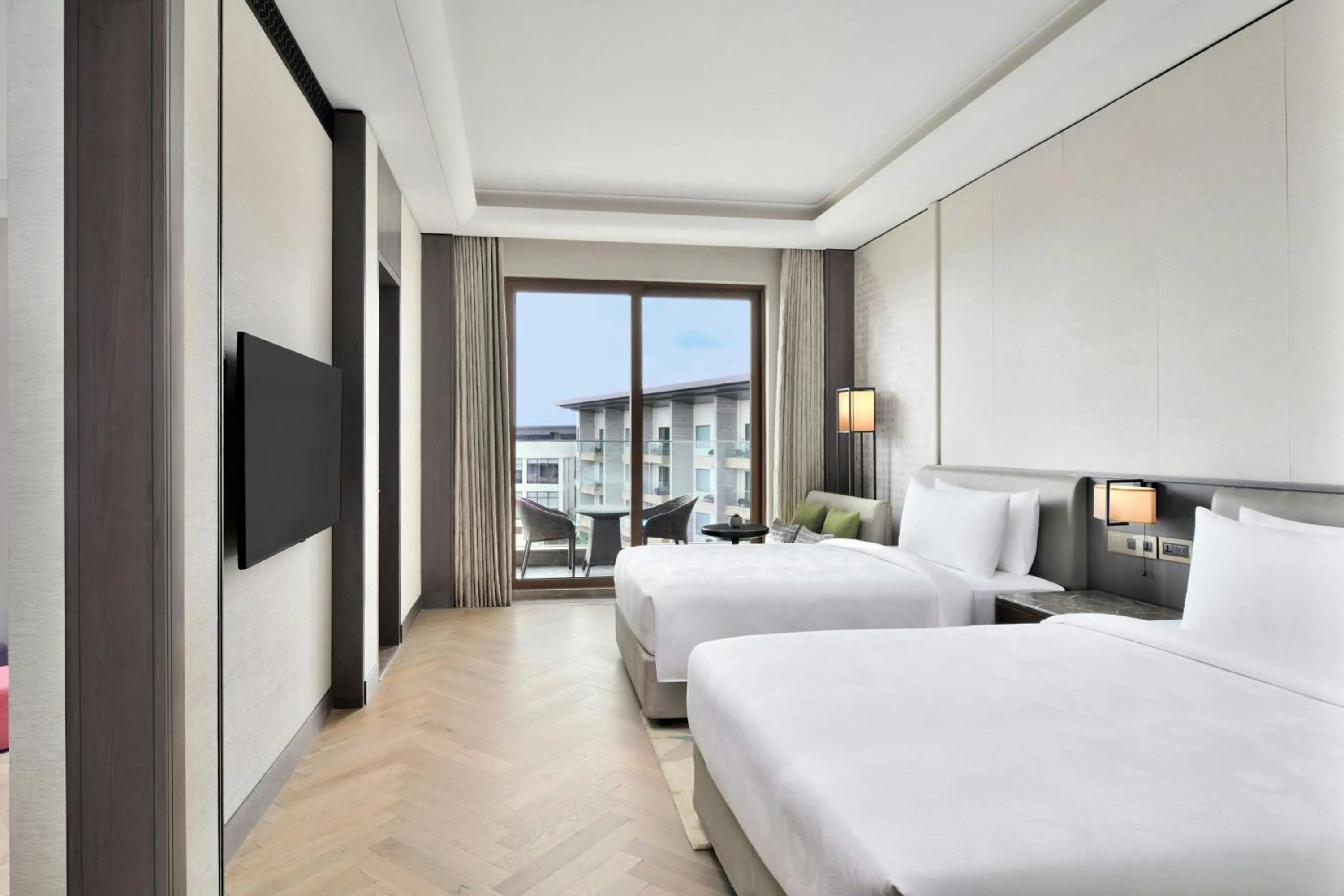 Photo of the whole room, Bed in JW Marriott Hotel Bengaluru Prestige Golfshire Resort & Spa