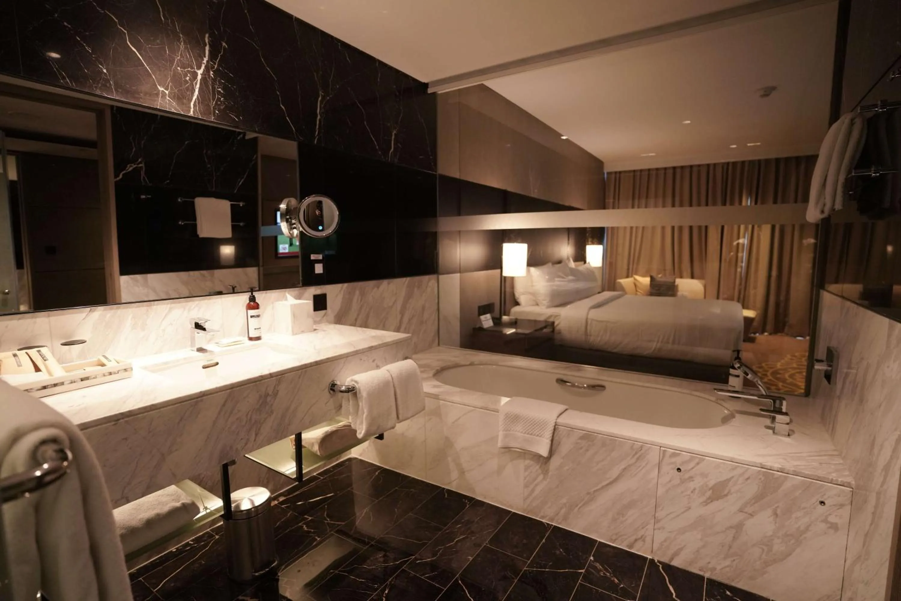 Bathroom, Bed in Hilton Bengaluru Embassy Manyata Business Park