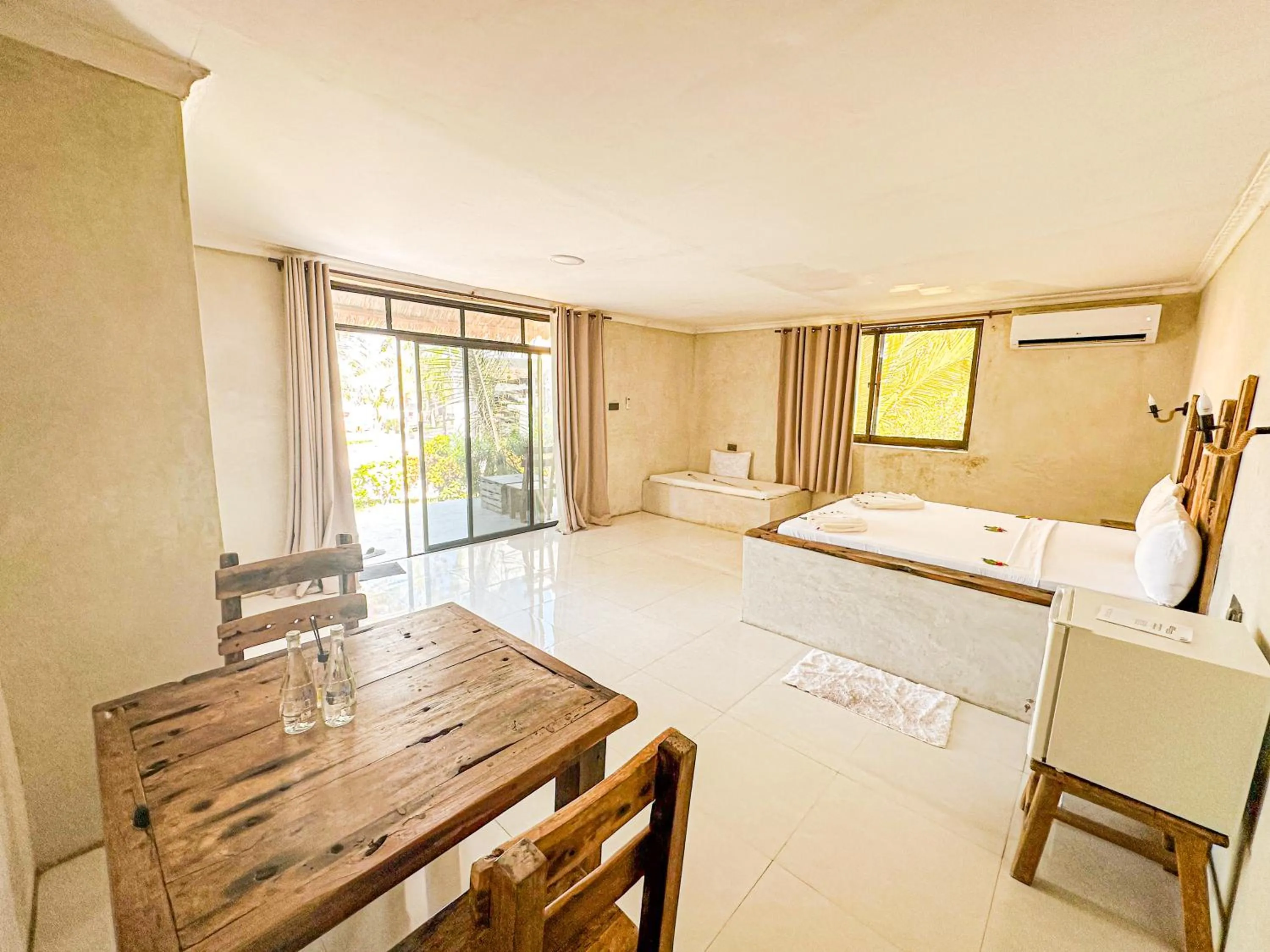 Bed in Jambo Beach Hotel Paje