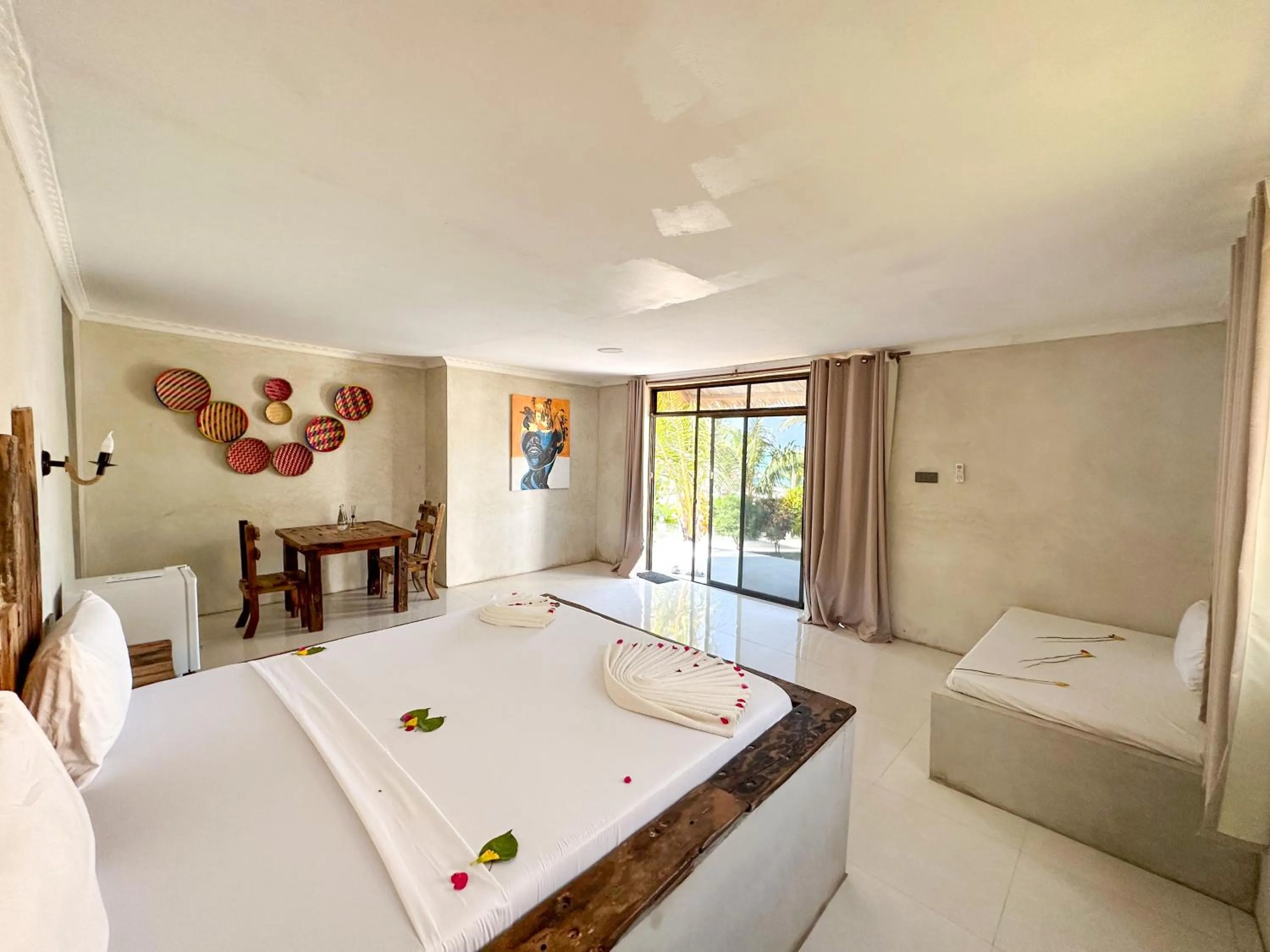 Bed in Jambo Beach Hotel Paje