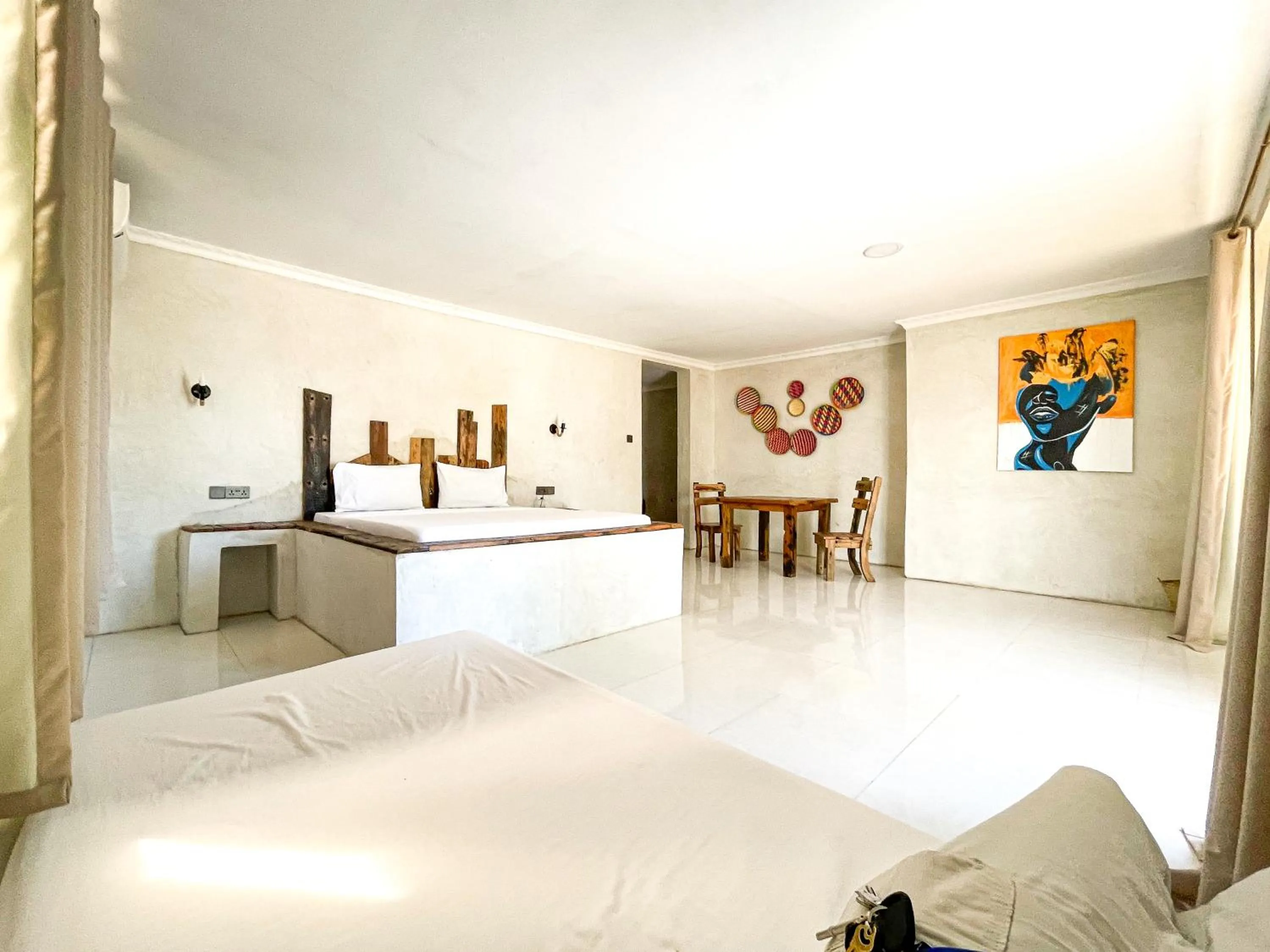 Bed in Jambo Beach Hotel Paje