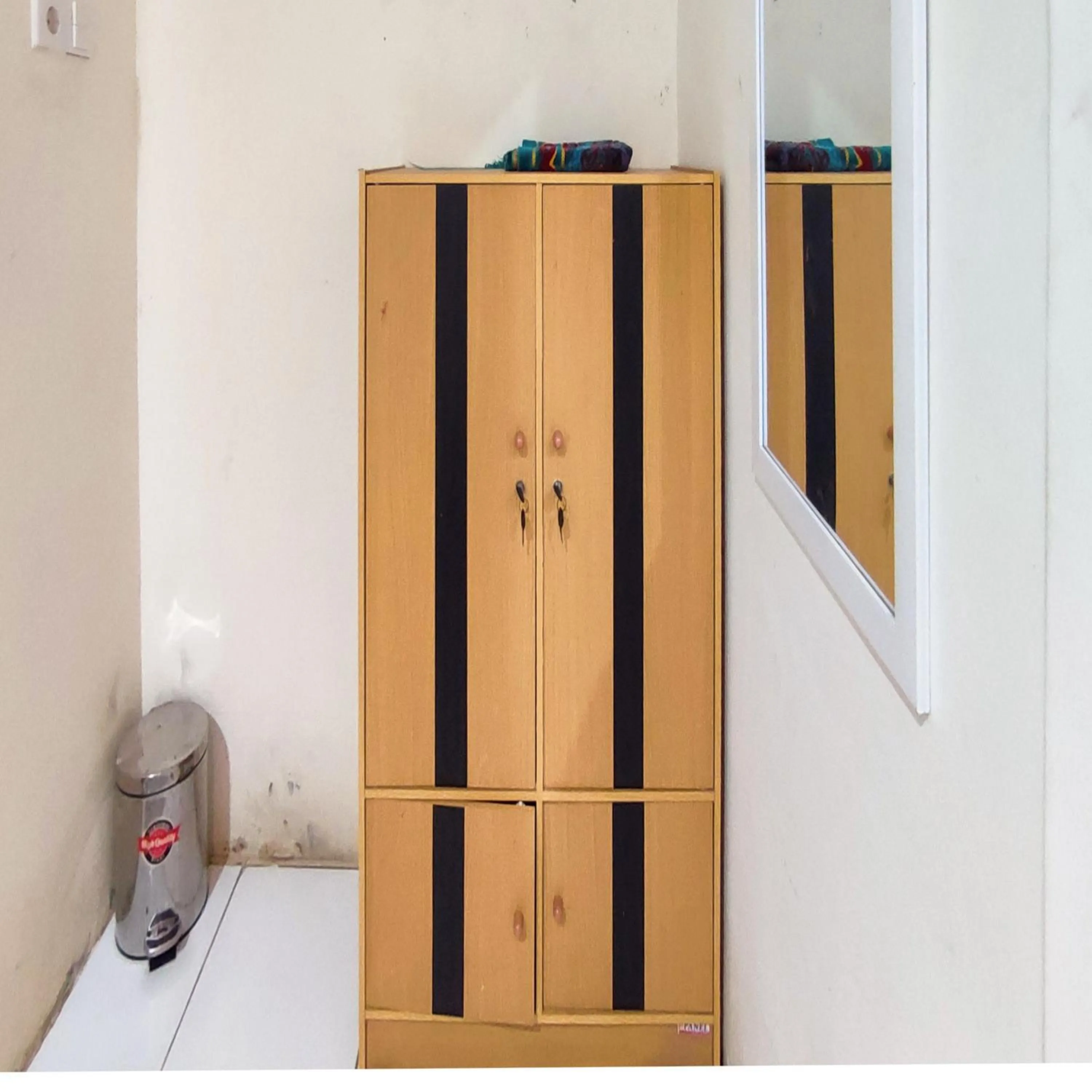 Bedroom in RedDoorz Syariah at Khalifi Guest House Padang